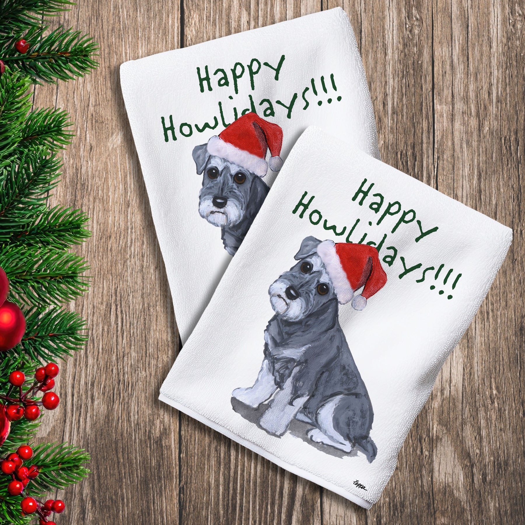 2 Kitchen Towels with a Schnauzer puppy in a Santa Hat and Happy Howlidays text.
