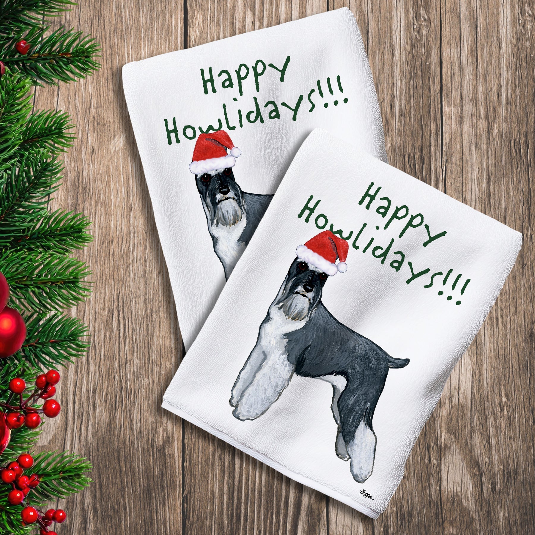 2 Kitchen Towels with a standing Schnauzer in a Santa Hat and Happy Howlidays text.
