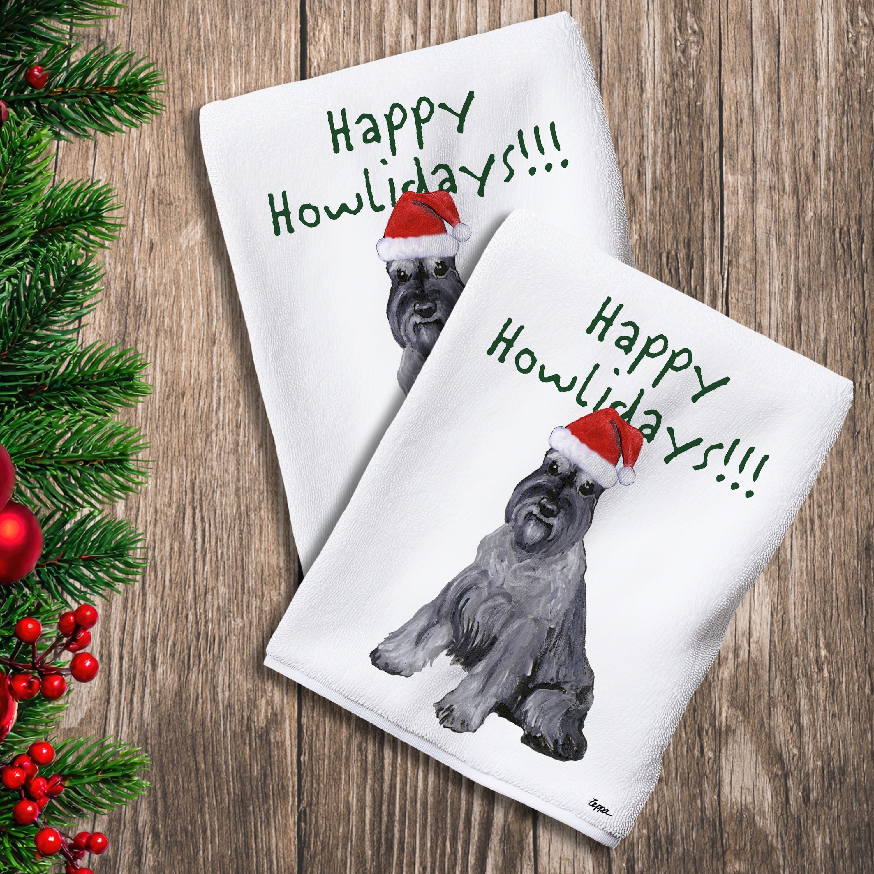 2 Kitchen Towels with a Schnauzer in a Santa Hat and Happy Howlidays text.
