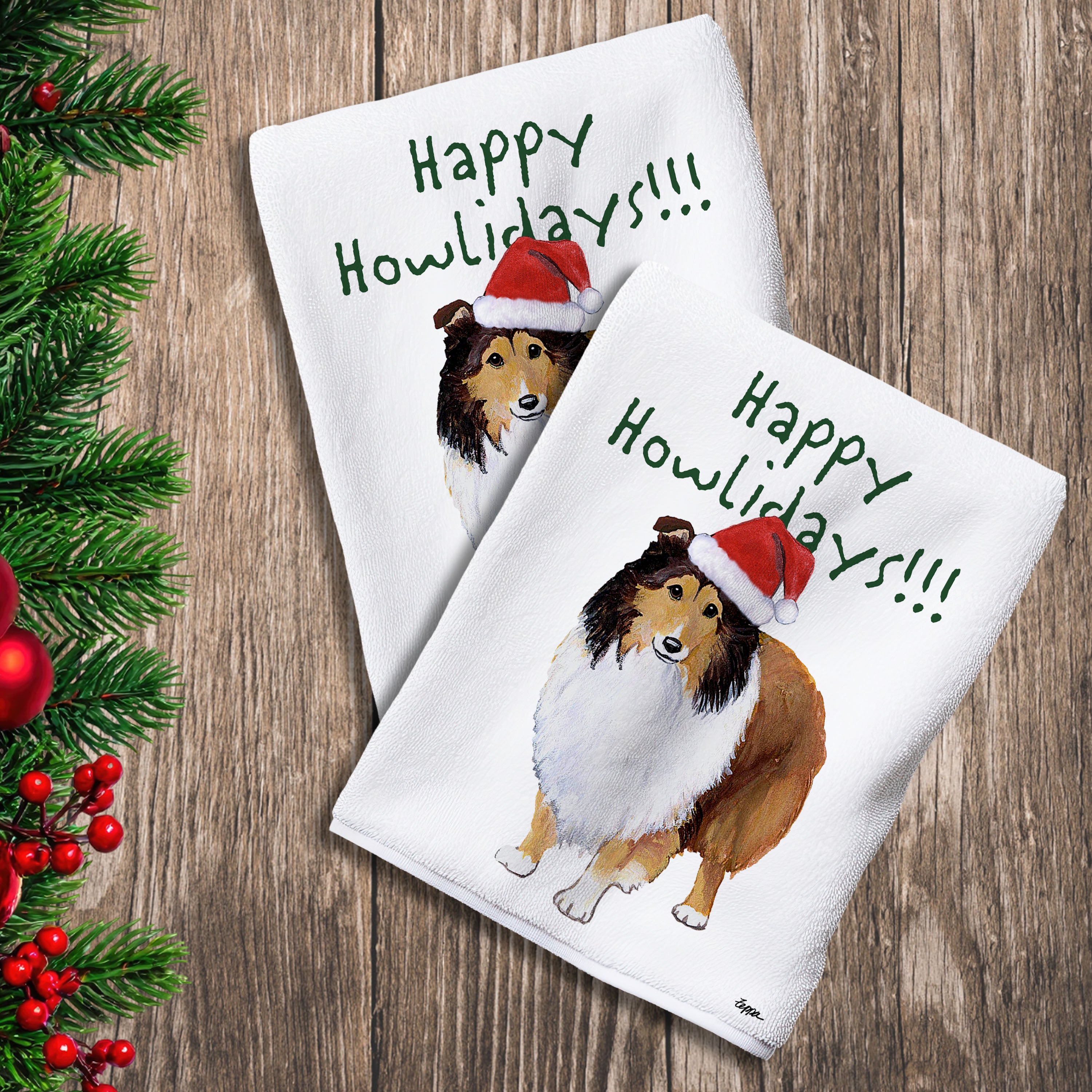 2 Kitchen Towels with a Shetland Sheepdog in a Santa Hat and Happy Howlidays text.
