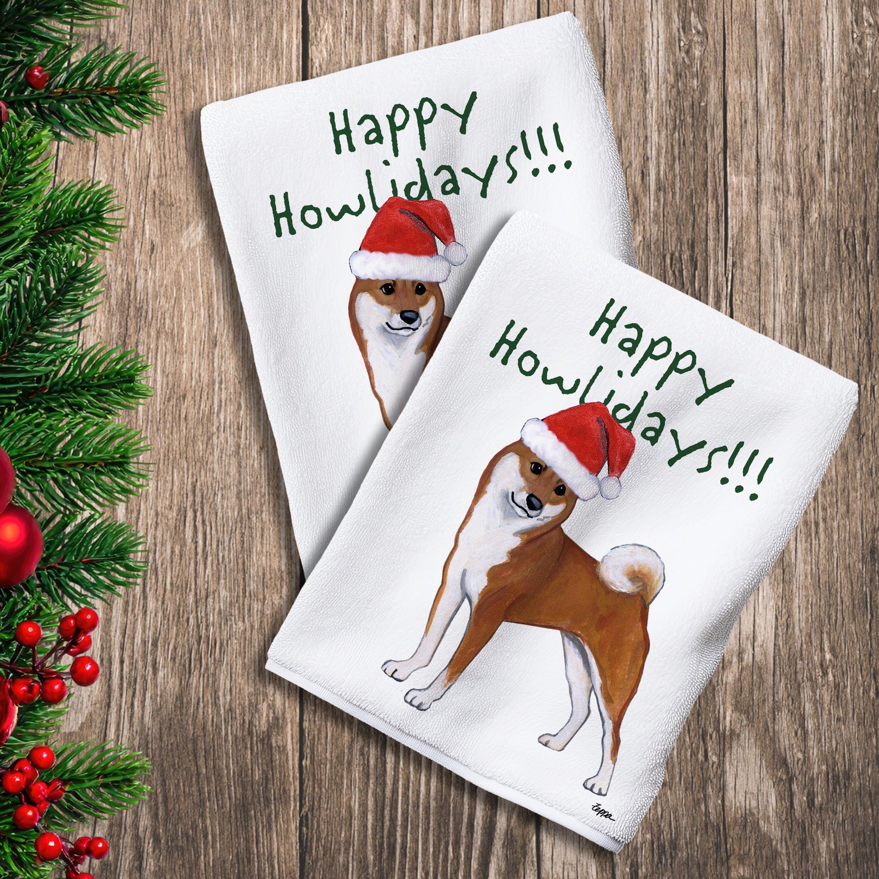 2 Kitchen Towels with a Shiba Inu in a Santa Hat and Happy Howlidays text.
