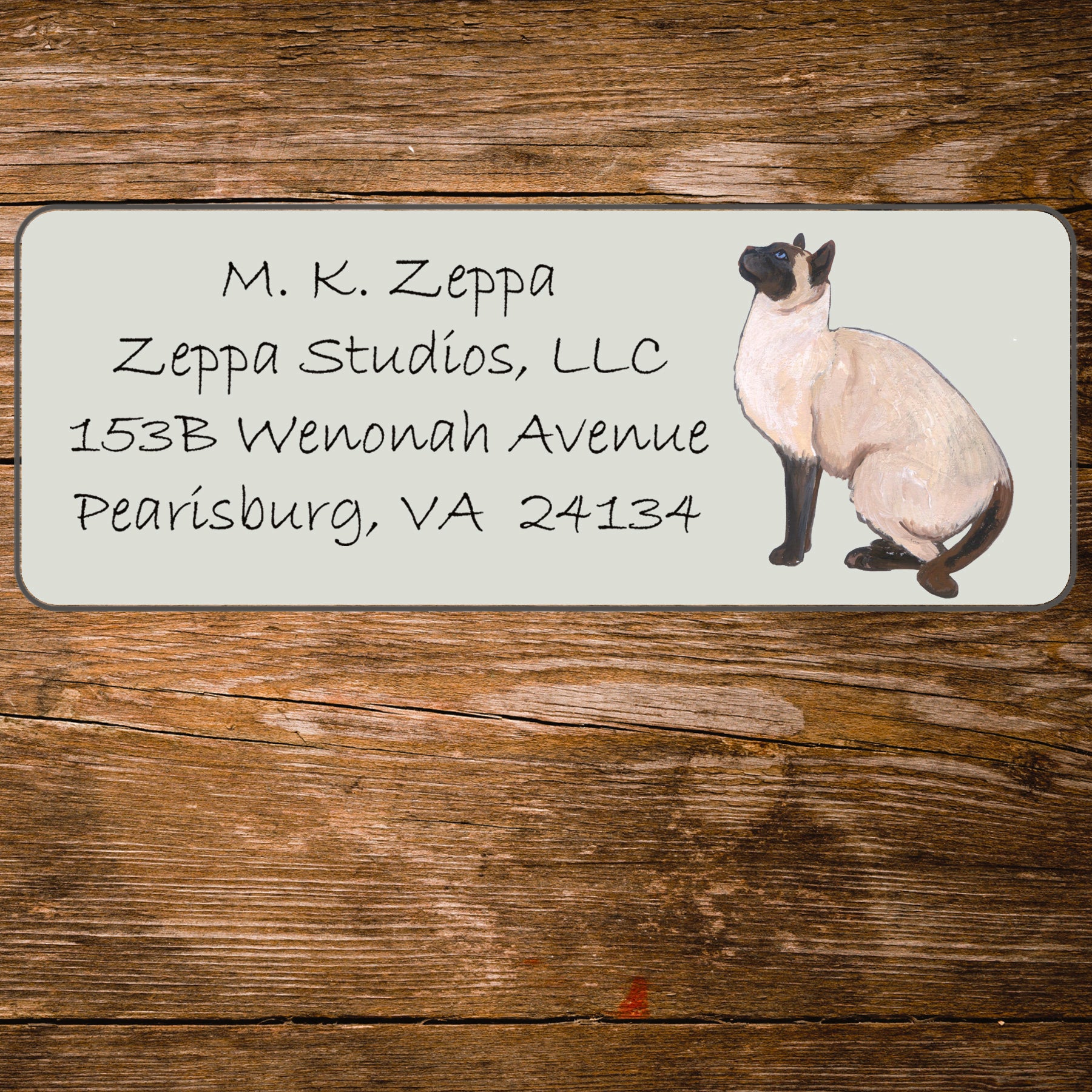 Return address label with a Siamese Cat illustration.