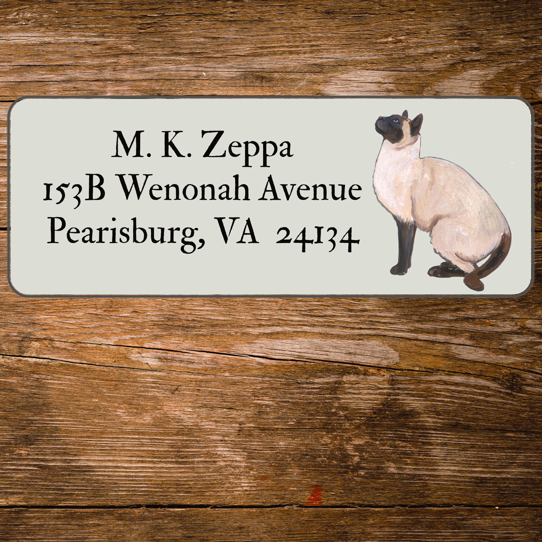 Return address label with a Siamese Cat illustration.