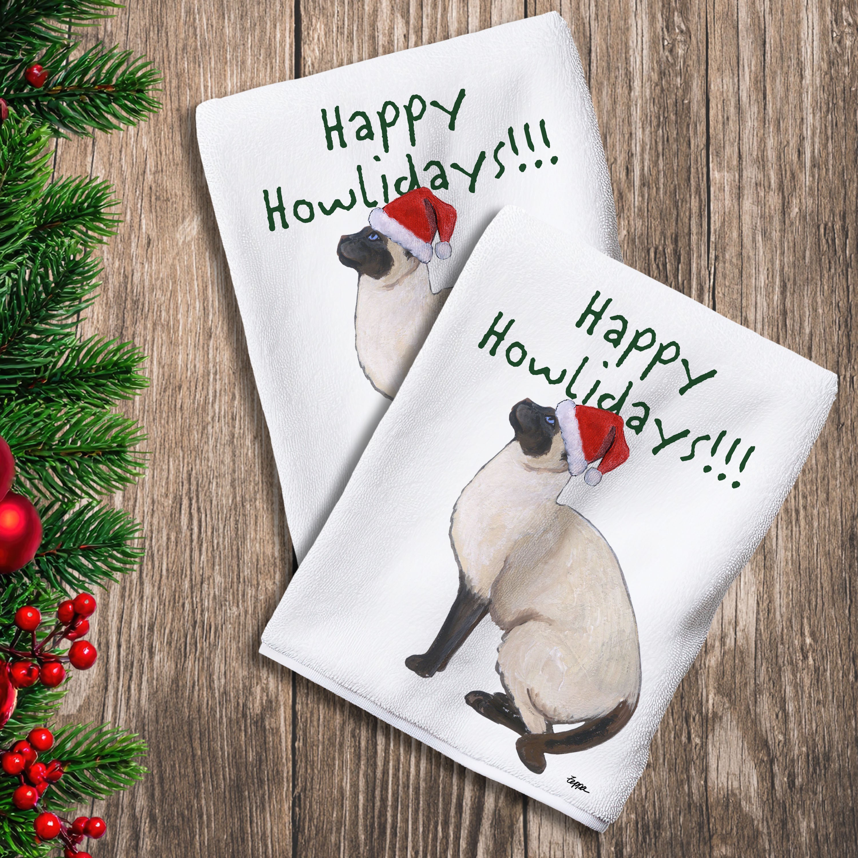 2 Kitchen Towels with a Siamese Cat in a Santa Hat and Happy Howlidays text.
