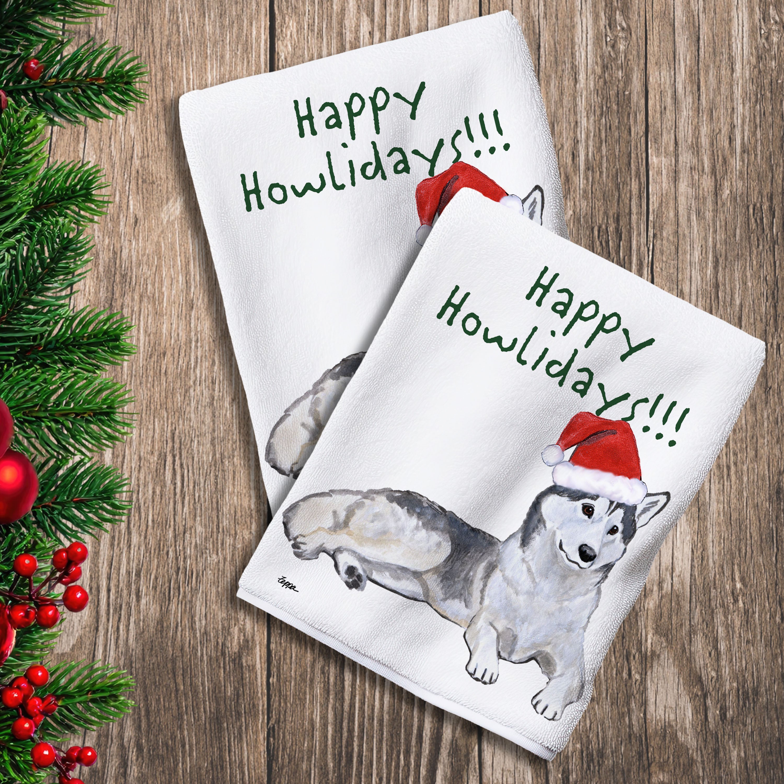 2 Kitchen Towels with a Siberian Husky in a Santa Hat and Happy Howlidays text.
