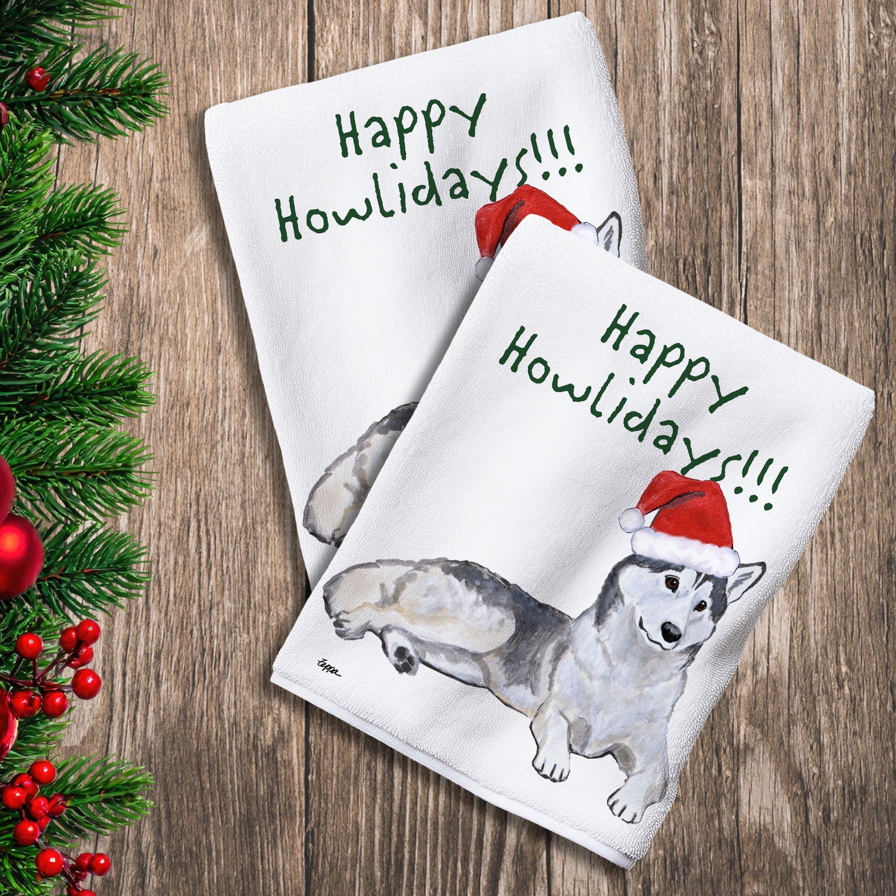 2 Kitchen Towels with a Siberian Husky in a Santa Hat and Happy Howlidays text.
