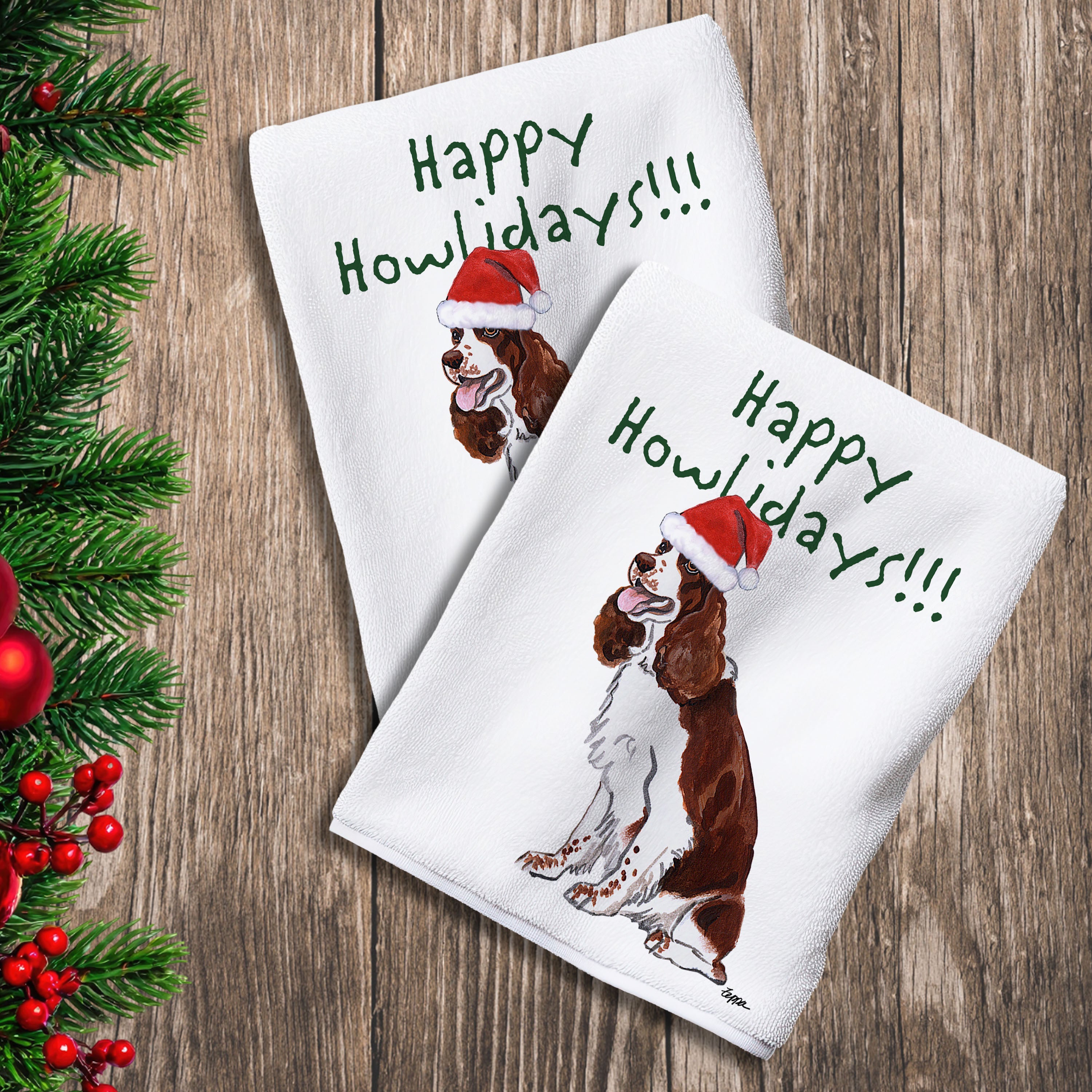 2 Kitchen Towels with a liver and white Springer Spaniel in a Santa Hat and Happy Howlidays text.
