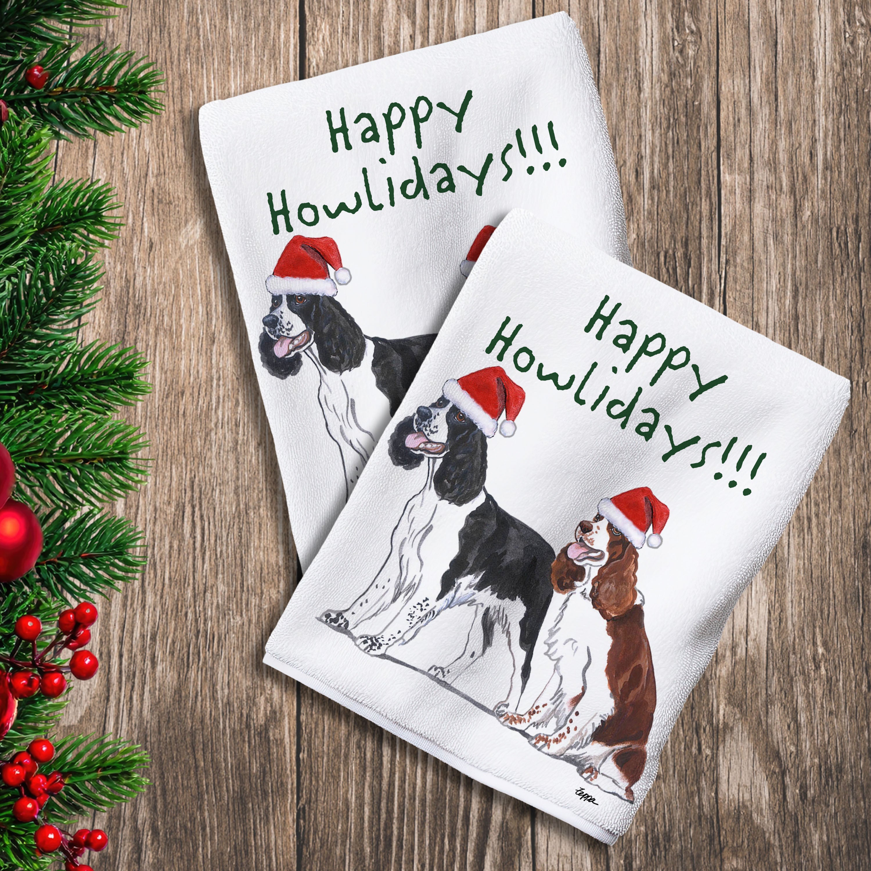 2 Kitchen Towels with a pair of Springer Spaniels in a Santa Hat and Happy Howlidays text.
