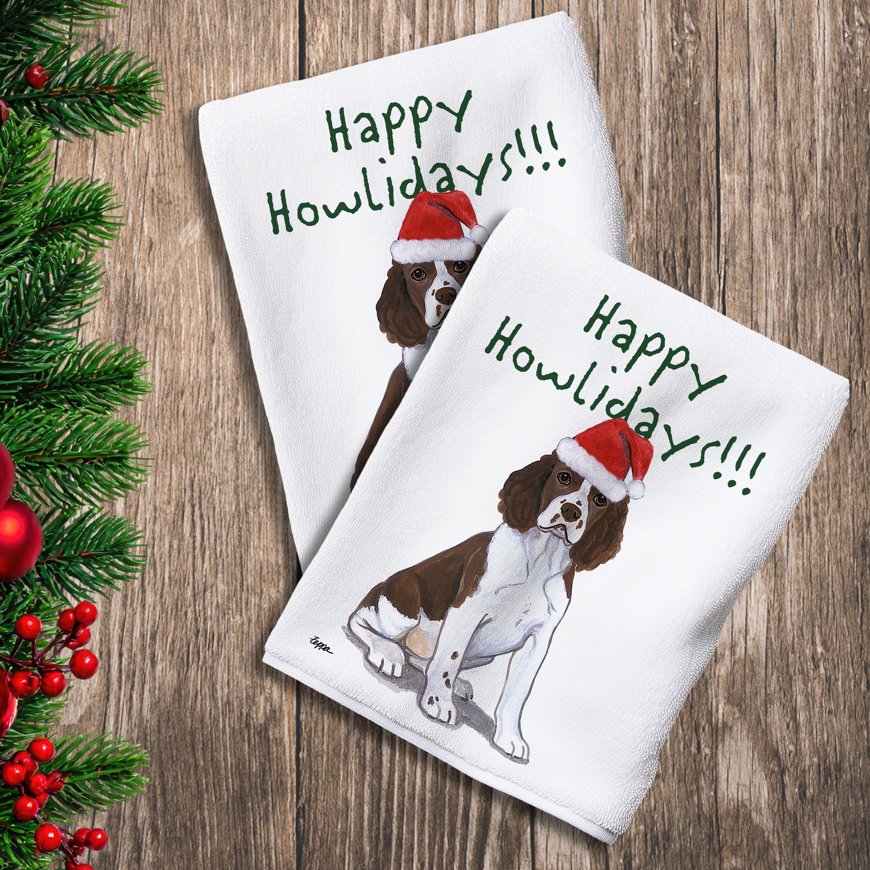 2 Kitchen Towels with a Springer Spaniel  puppy in a Santa Hat and Happy Howlidays text.

