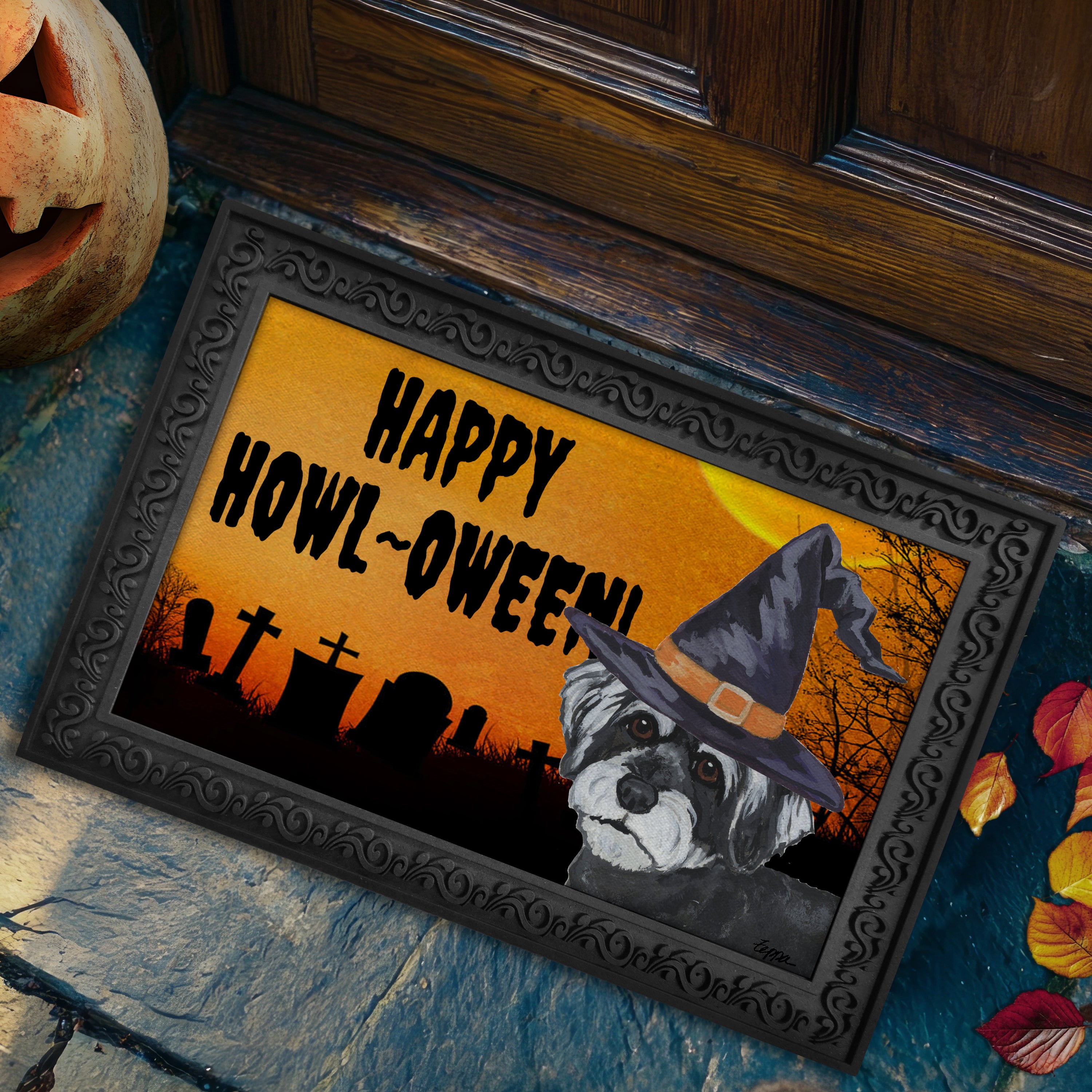 Schnoodle in a witch's hat on a Happy Howl-ween doormat.