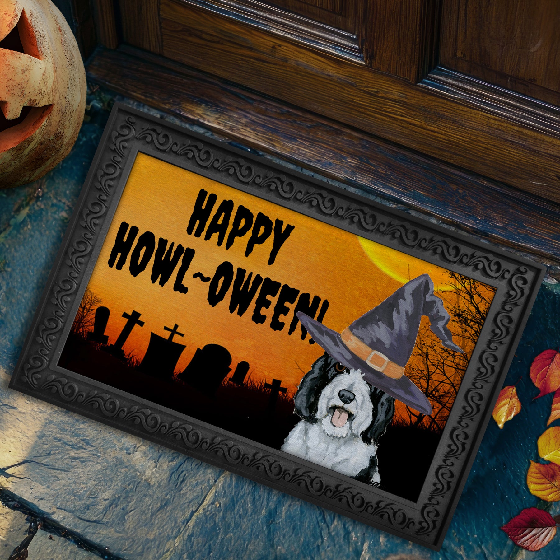 Sheepadoodle in a witch's hat on a Happy Howl-ween doormat.