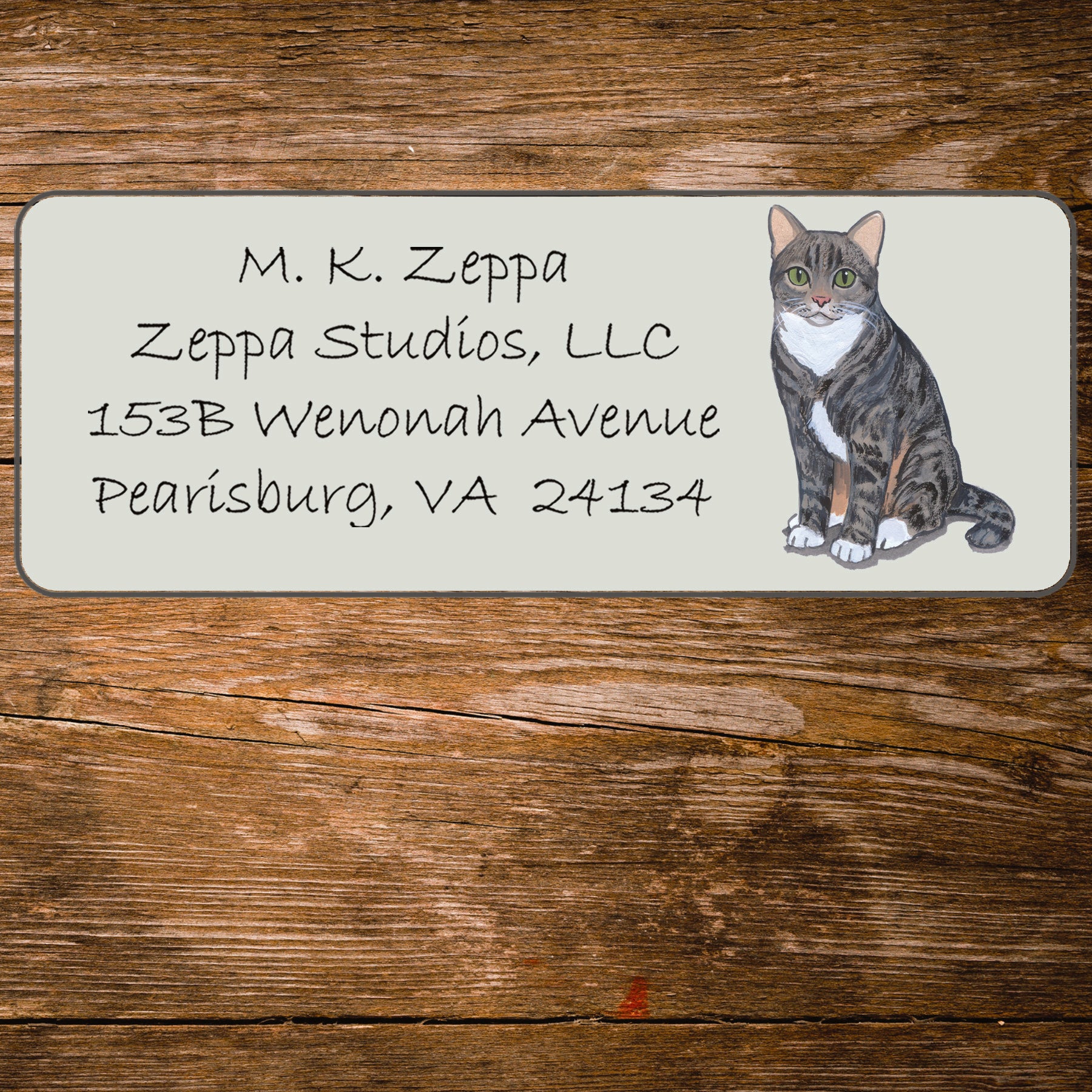 Return address label with a Tabby Cat illustration.