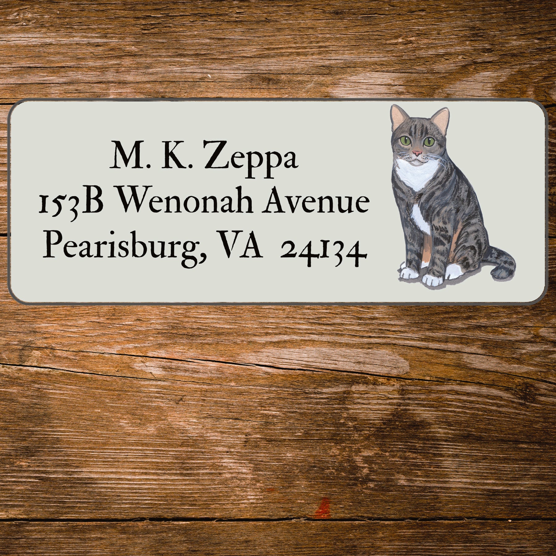 Return address label with a Tabby Cat illustration.