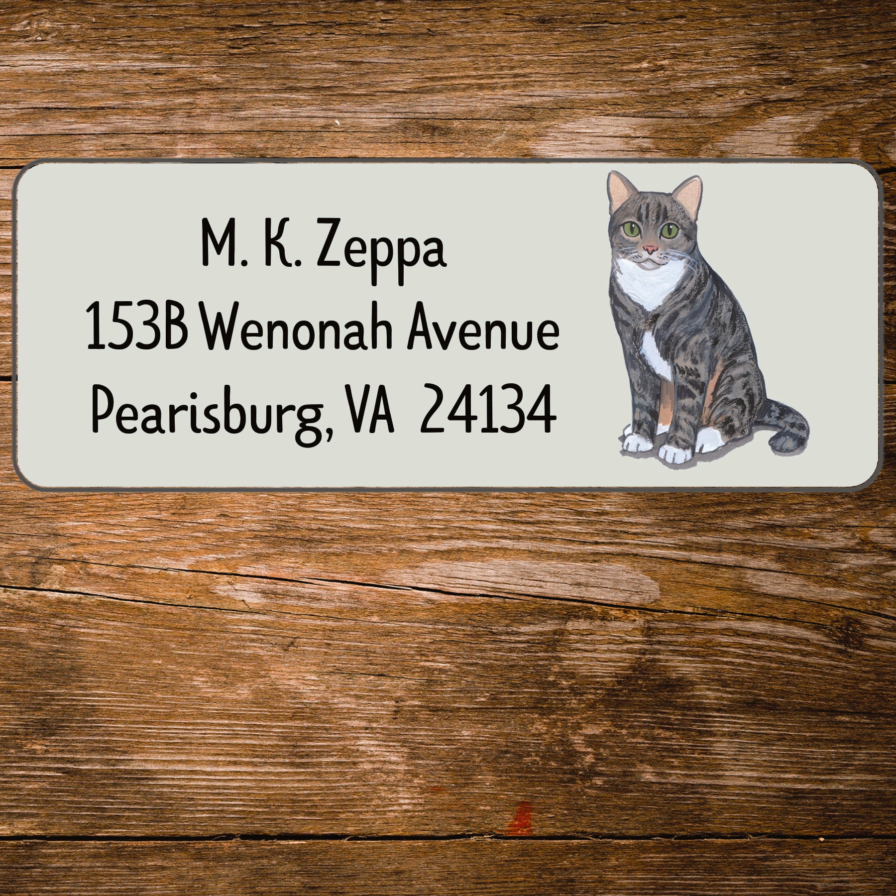 Return address label with a Tabby Cat illustration.