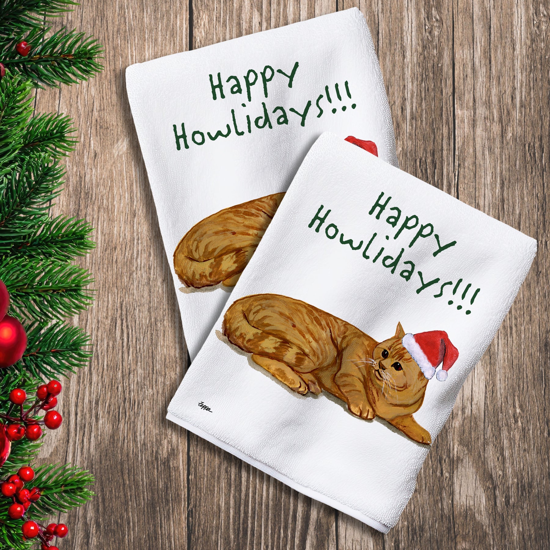 2 Kitchen Towels with a Red Tabby Cat in a Santa Hat and Happy Howlidays text.
