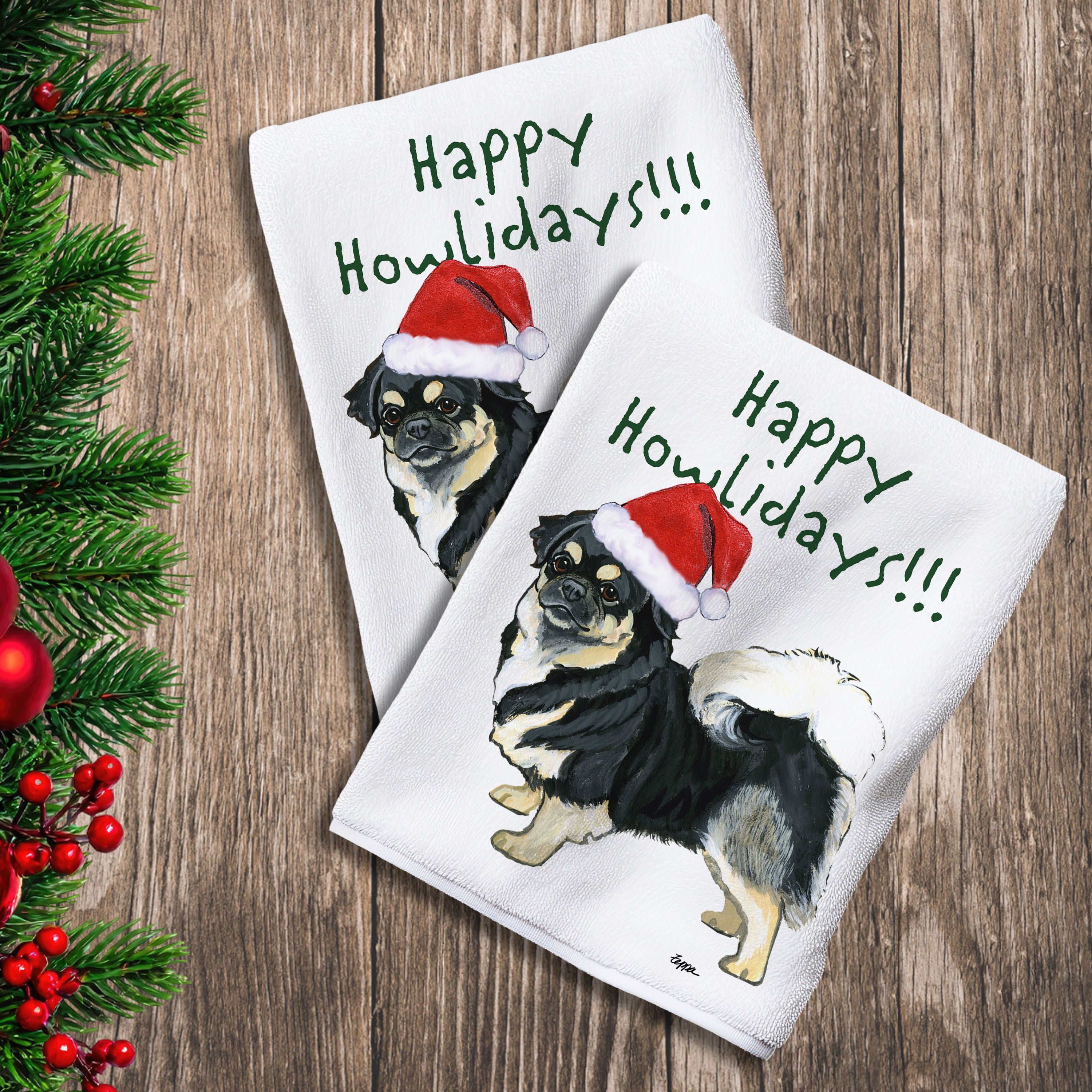 2 Kitchen Towels with a black and tan Tibetan Spaniel in a Santa Hat and Happy Howlidays text.