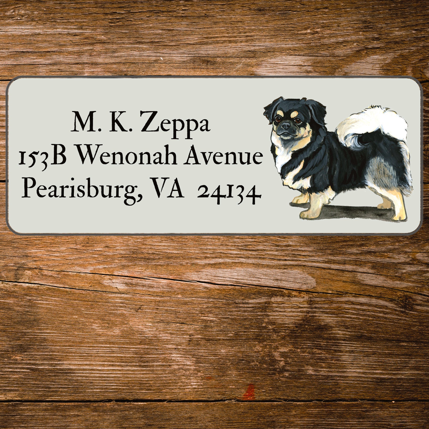 Return address label with a Tibetan Spaniel illustration.