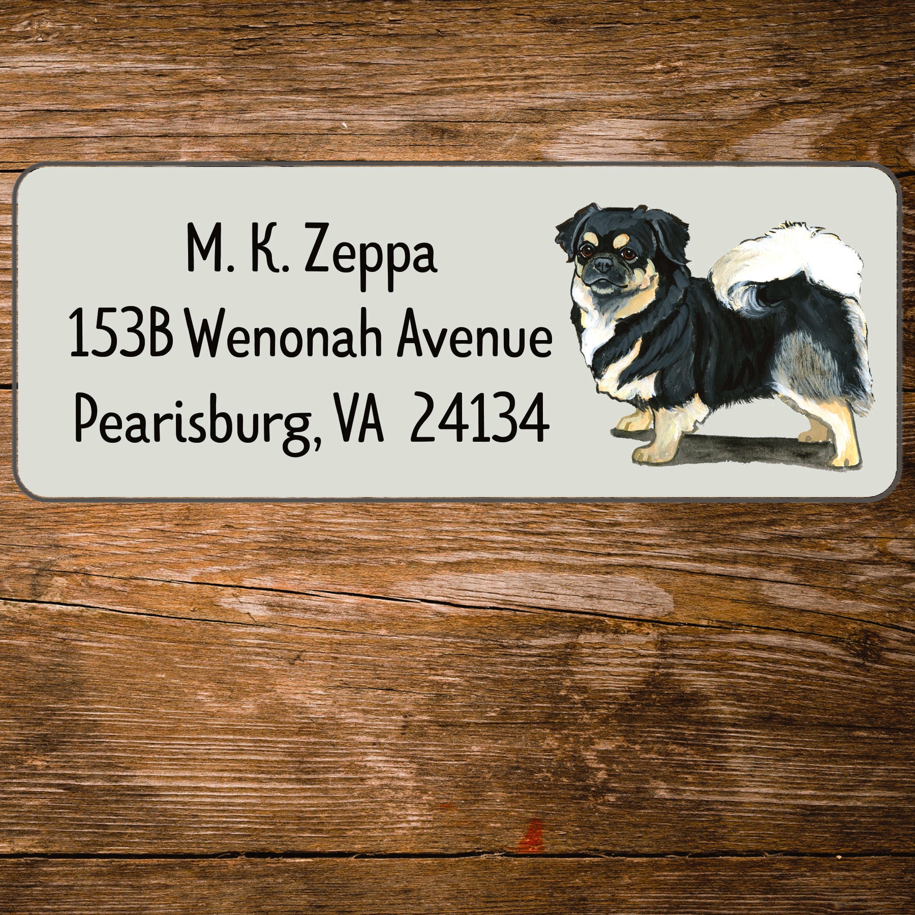 Return address label with a Tibetan Spaniel illustration.