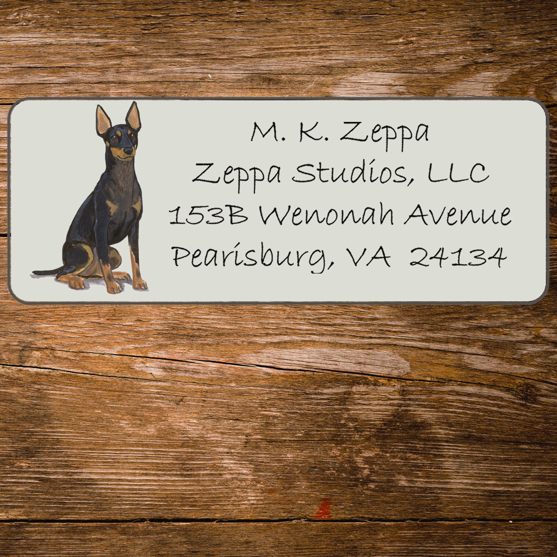 Return address label with a Toy Manchester Terrier illustration.