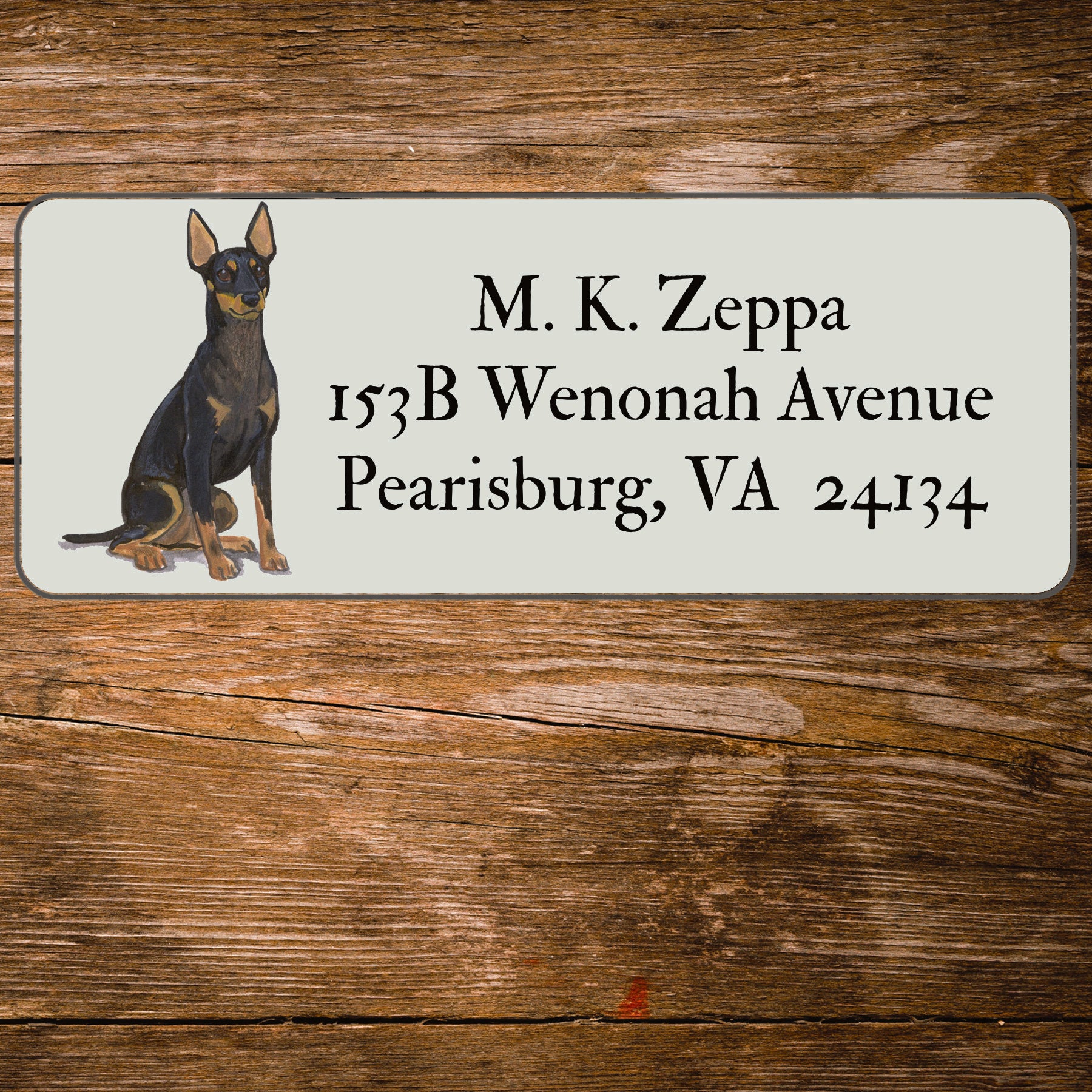 Return address label with a Toy Manchester Terrier illustration.