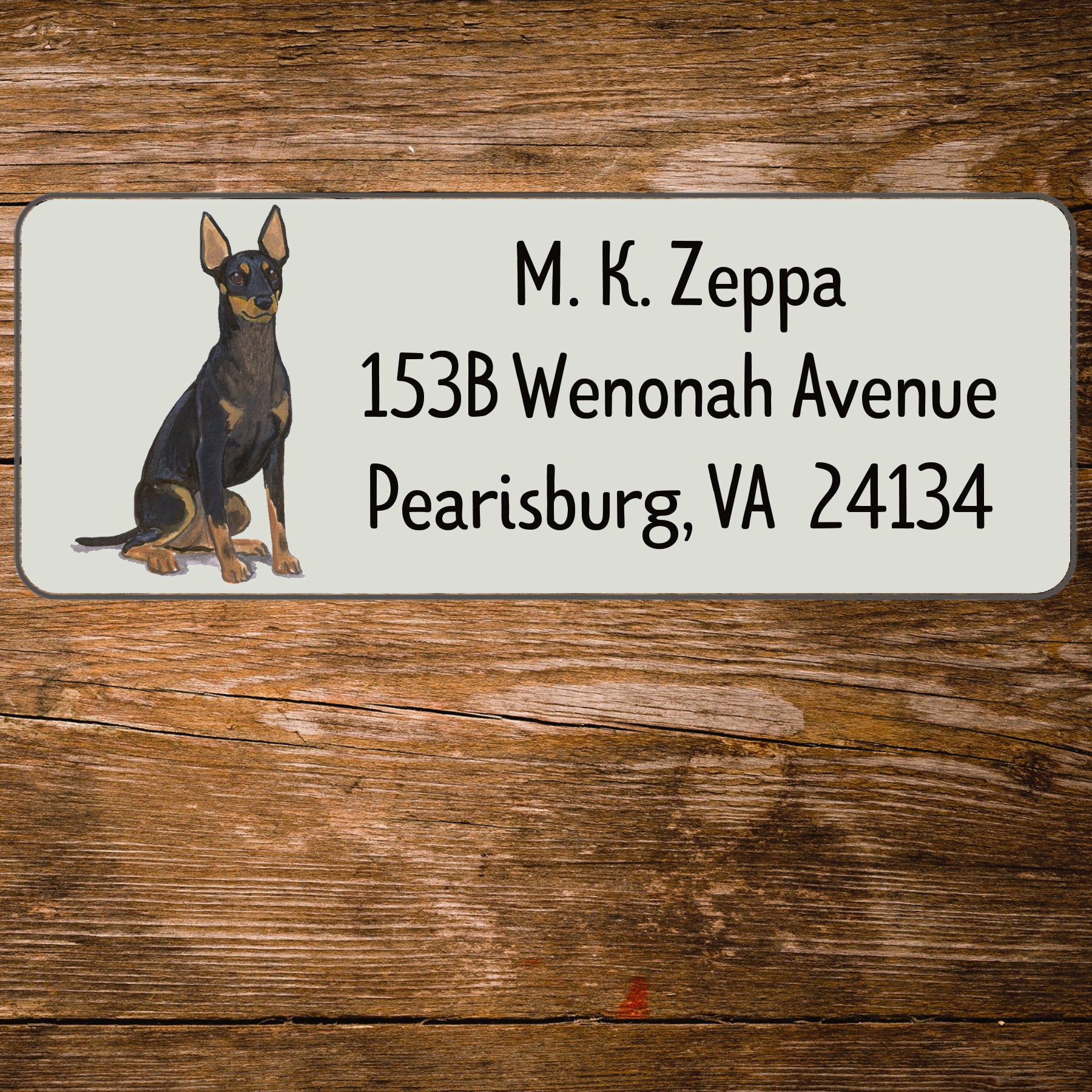 Return address label with a Toy Manchester Terrier illustration.
