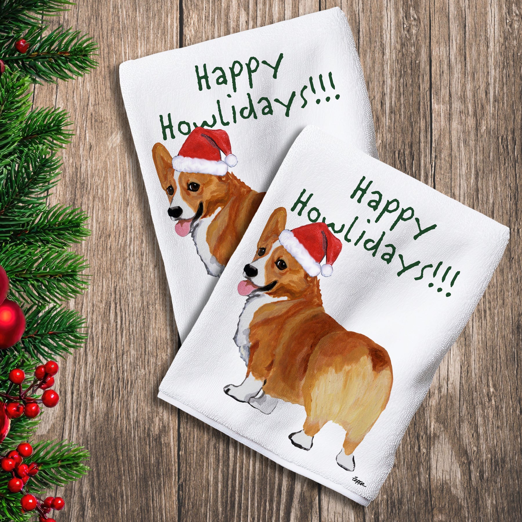 2 Kitchen Towels with a Welsh Corgi in a Santa Hat and Happy Howlidays text.