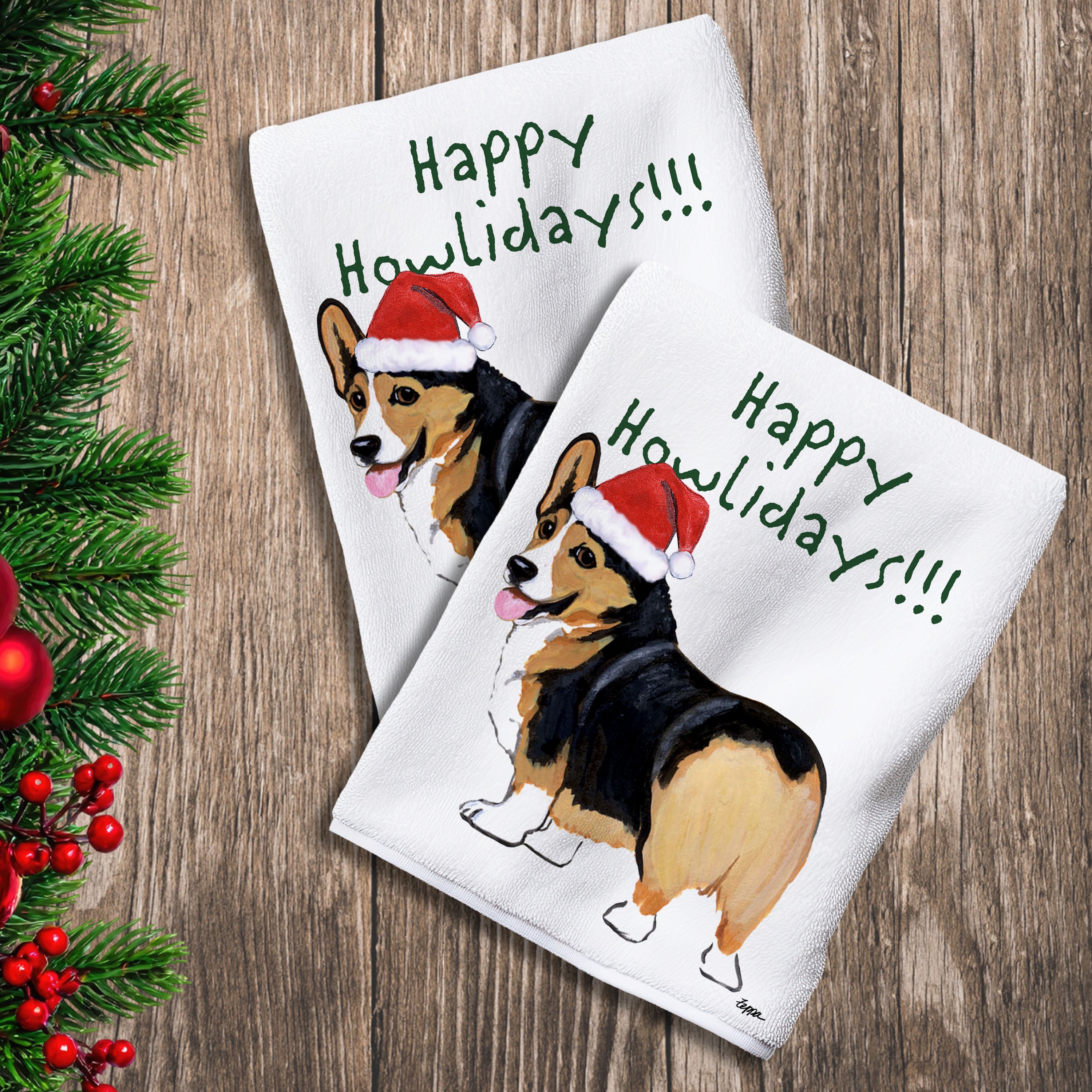 2 Kitchen Towels with a tri color Welsh Corgi in a Santa Hat and Happy Howlidays text.