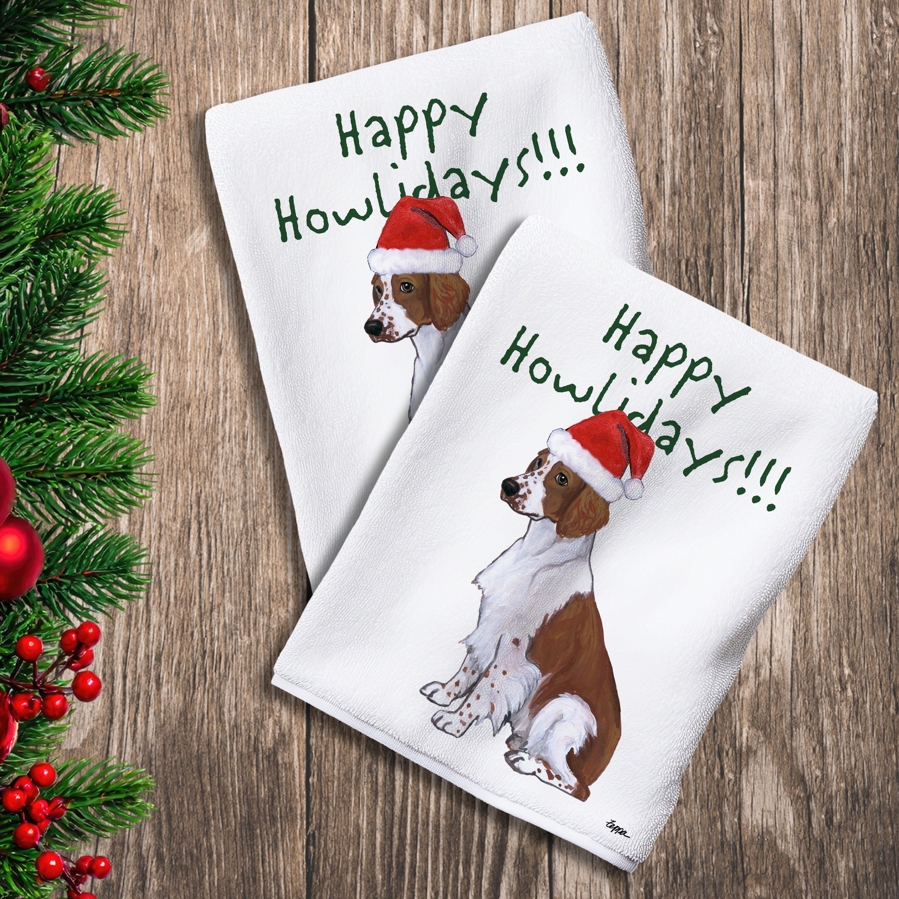 2 Kitchen Towels with a Welsh Springer in a Santa Hat and Happy Howlidays text.
