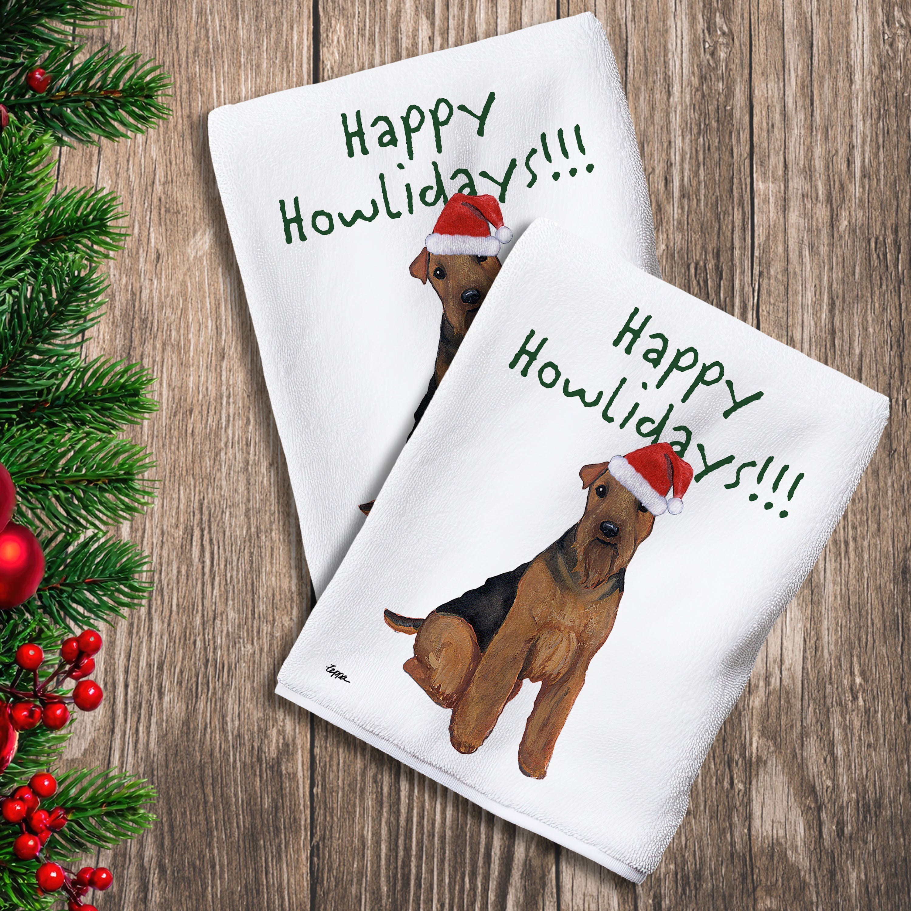 2 Kitchen Towels with a Welsh Terrier in a Santa Hat and Happy Howlidays text.
