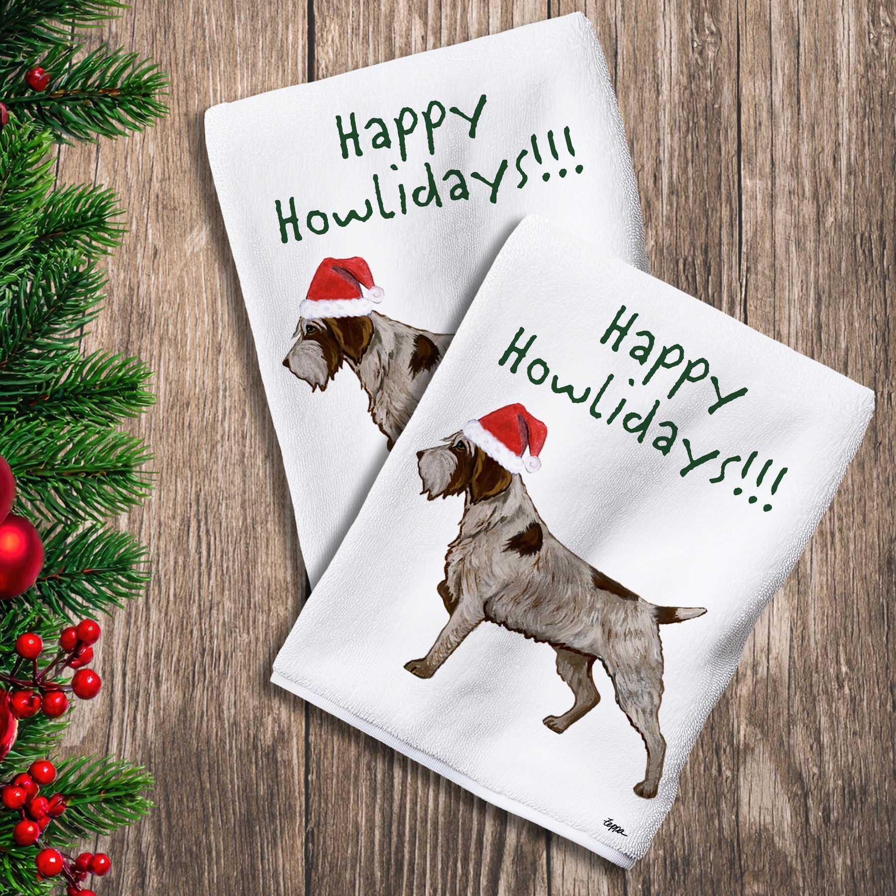 2 Kitchen Towels with a Wirehaired Pointing Griffon in a Santa Hat and Happy Howlidays text.