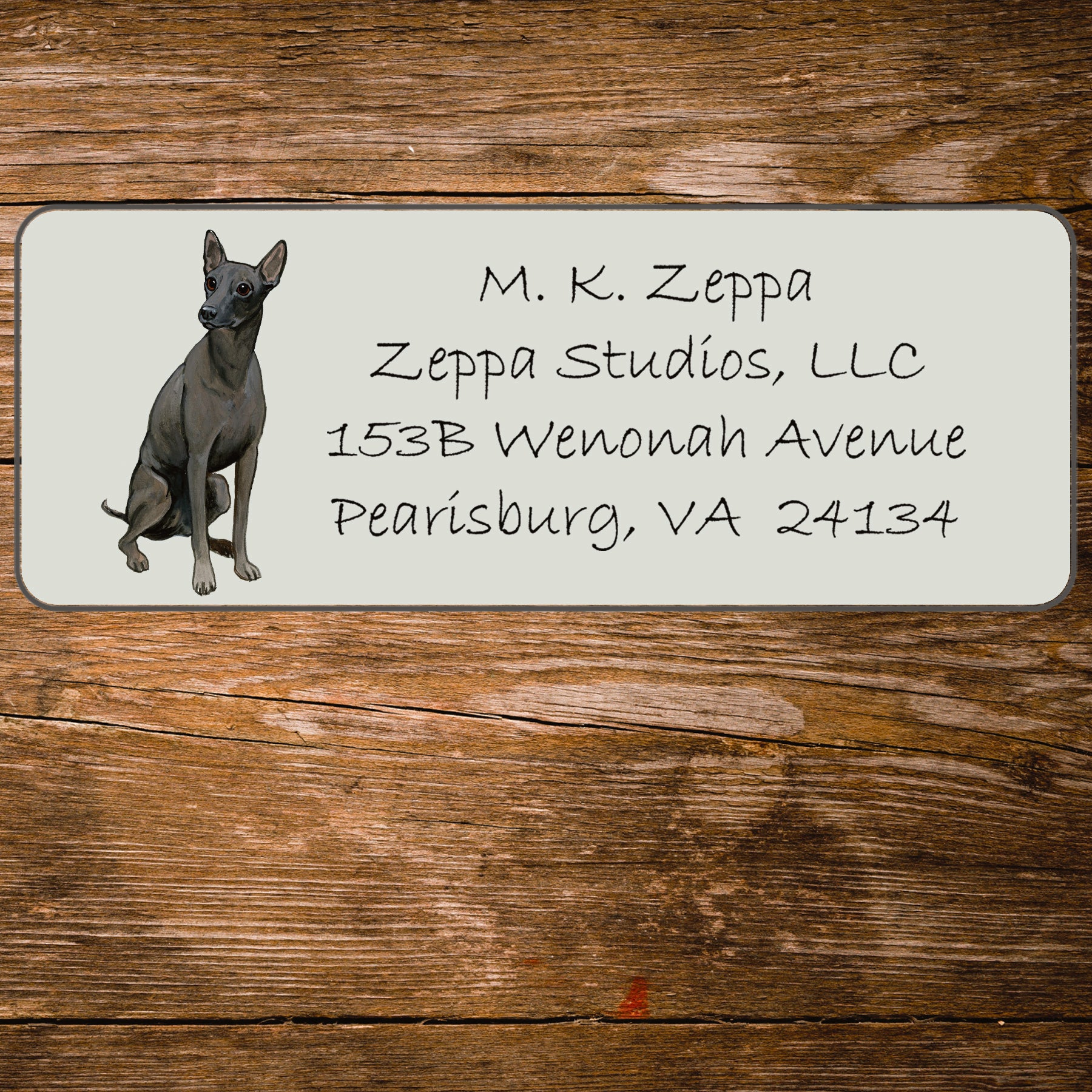 Return address label with an illustration of a Xoloitzcuintli