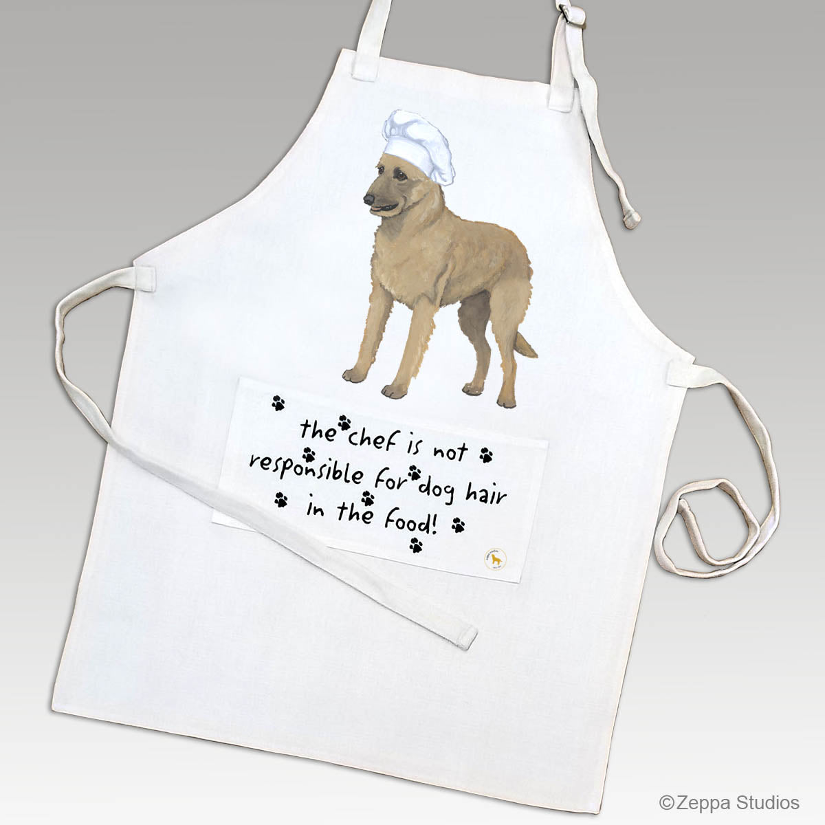 Linen chef's apron with a Belgian Laekenois in a chef's hat and a funny saying on the pocket.