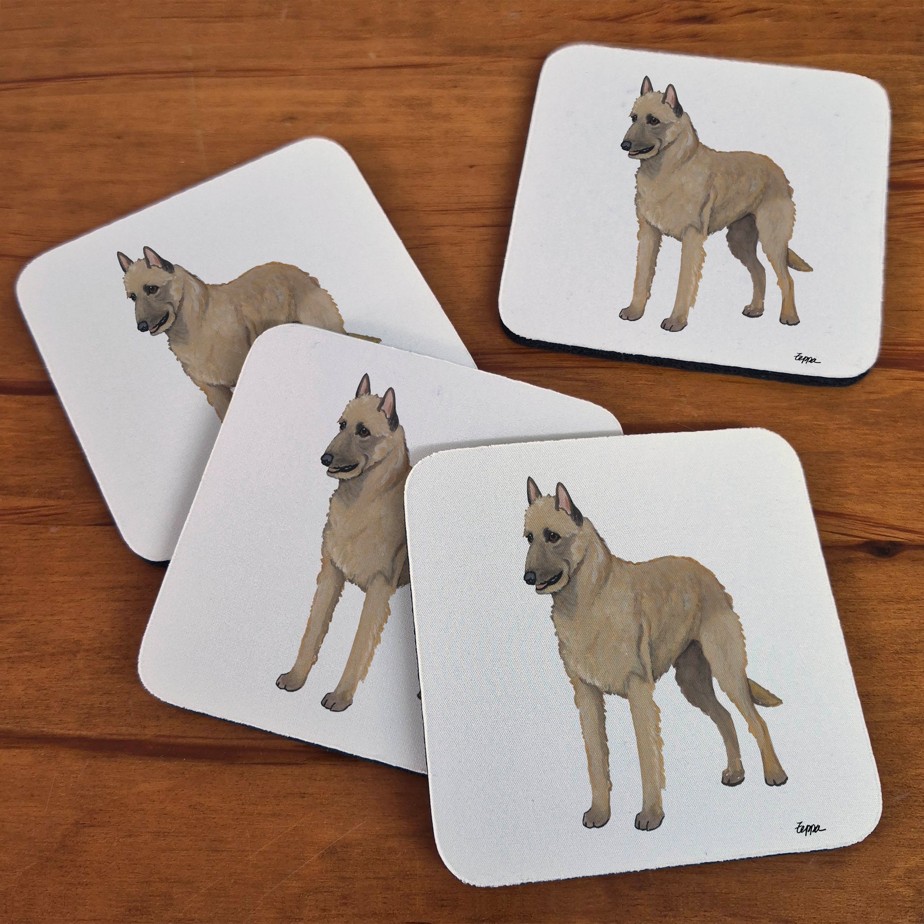 Rubber beverage coasters with a Belgian Laekenois on a plain beige background