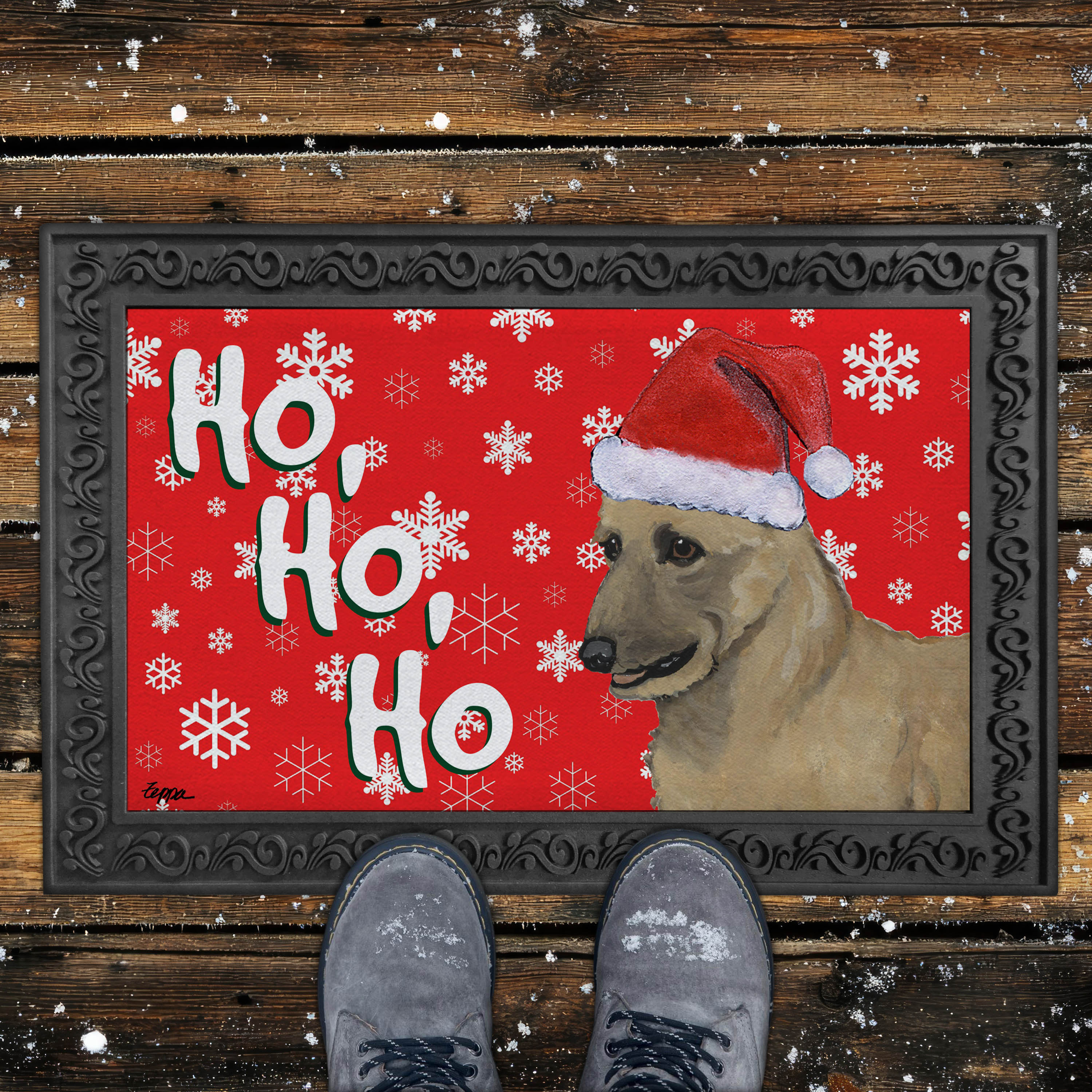 Holiday doormat with a Belgian Laekenois in a Santa hat on a red snowflake background
