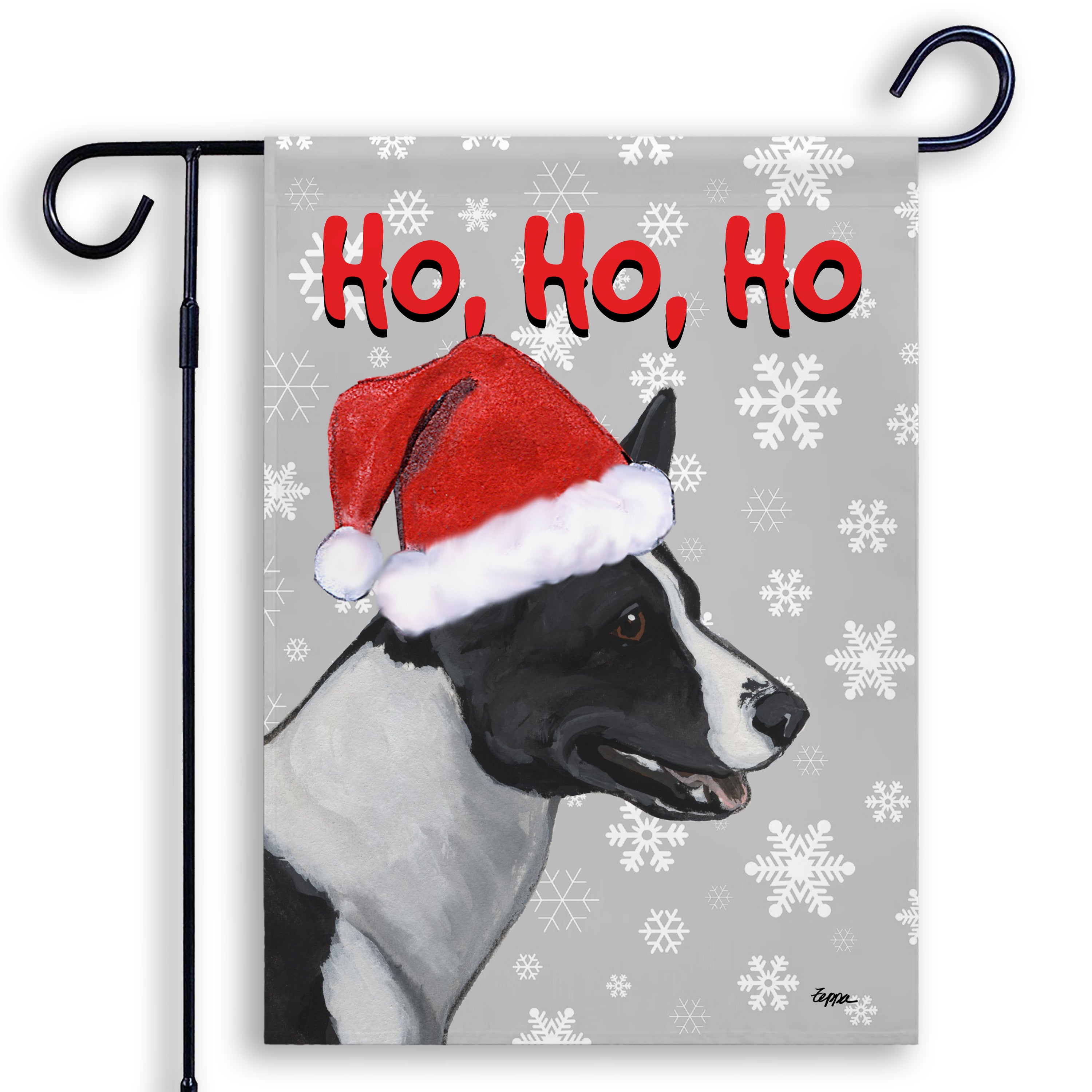 Christmas-themed garden flag with a canaan dog wearing a Santa hat and snowflakes on a gray background.