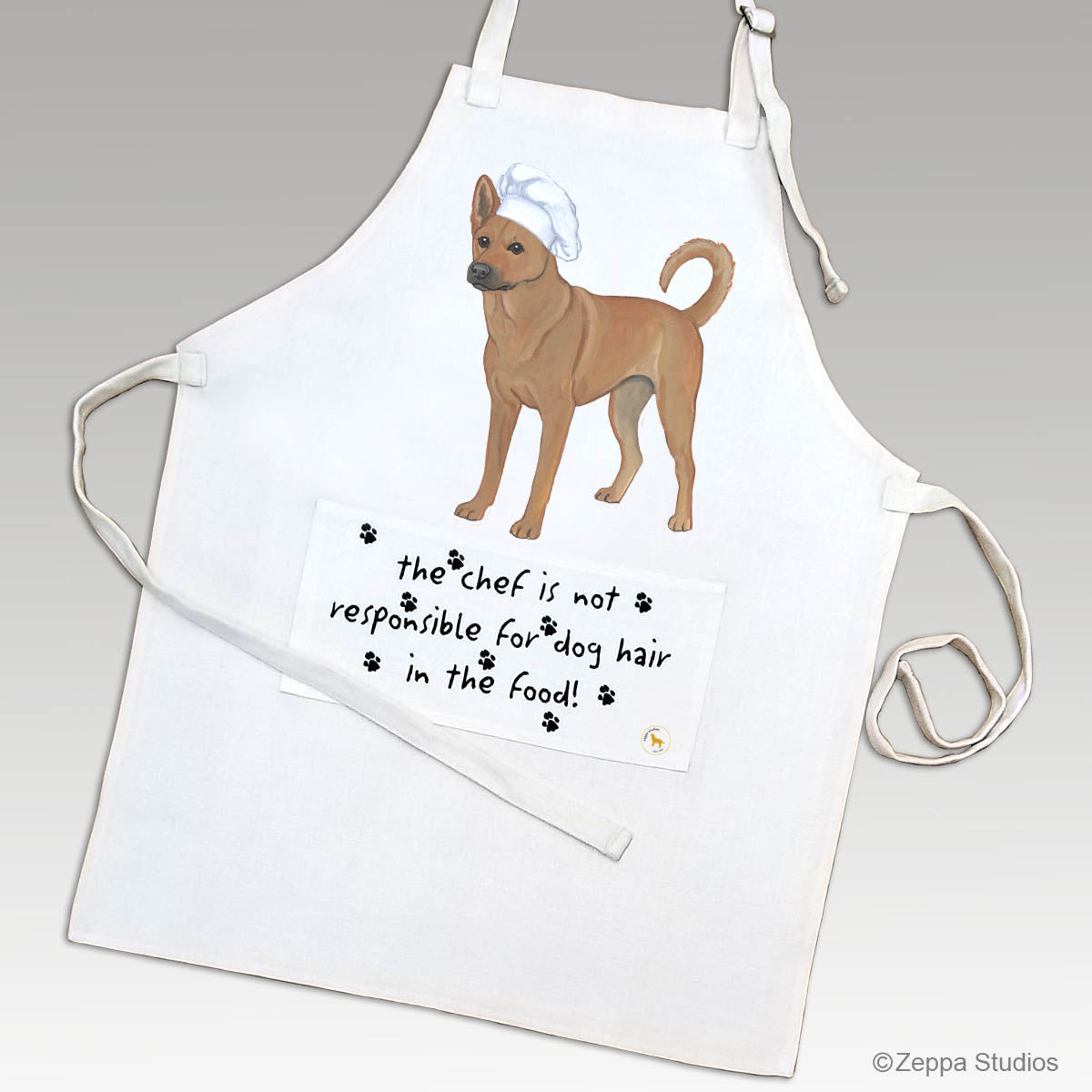 Carolina Dog in a chef's hat on a linen apron with funny text on the pocket.