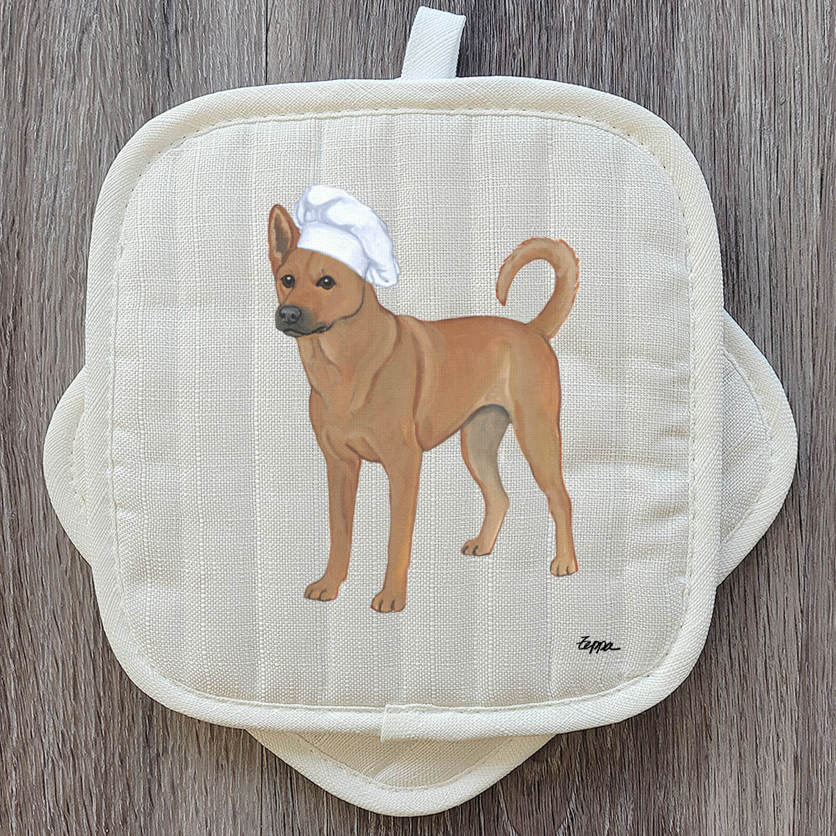 Carolina Dog in a chef's hat design on a set of pot holders.