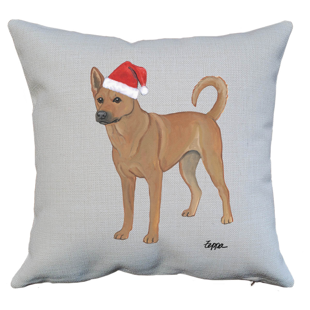 Carolina dog in a Santa hat on a linen throw pillow.