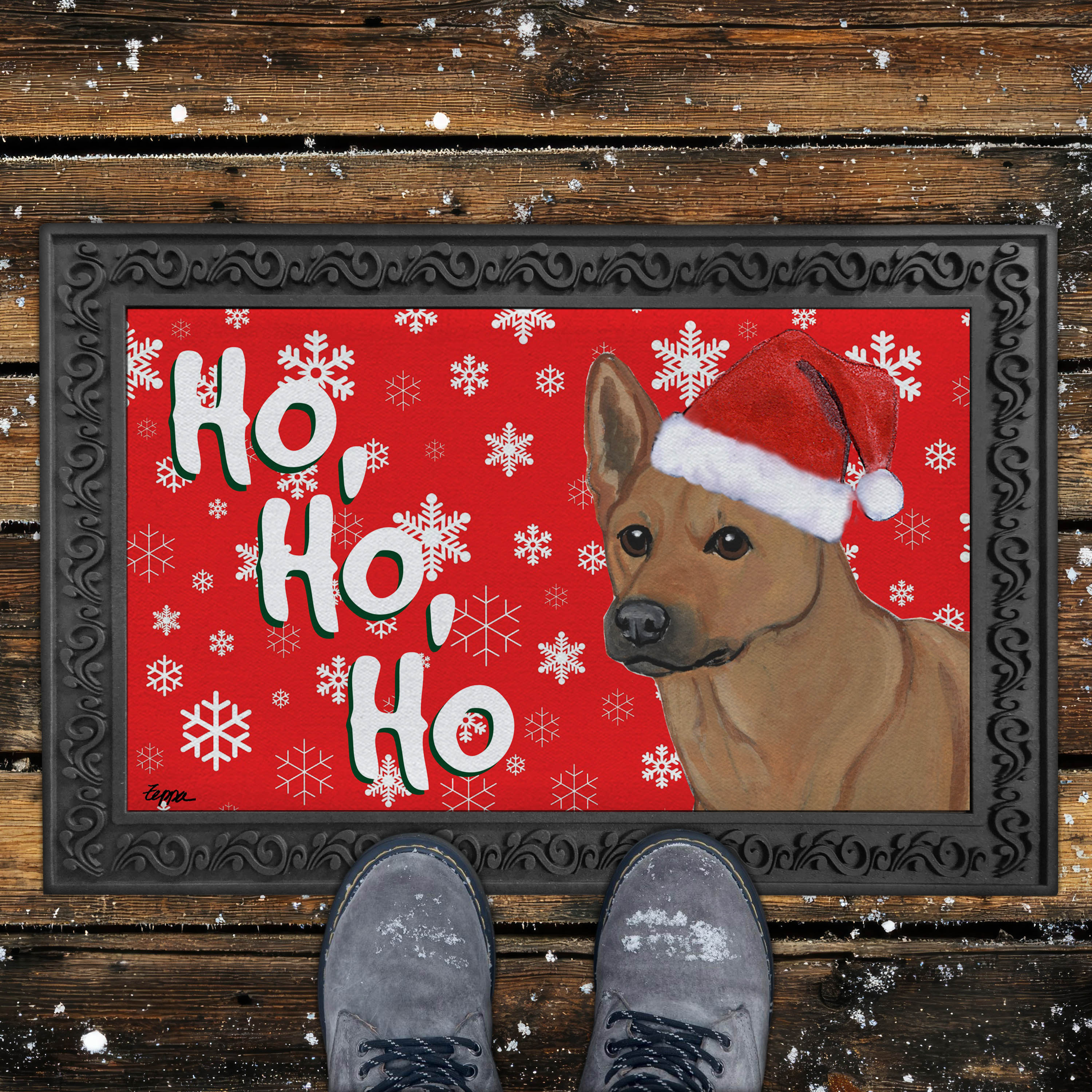 Doormat with a Carolina dog wearing a Santa hat and 'Ho, Ho, Ho' text on a red background with snowflakes.