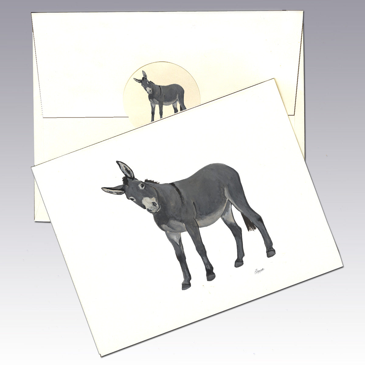 An ivory greeting card and matching envelope featuring a watercolor-style illustration of a donkey.