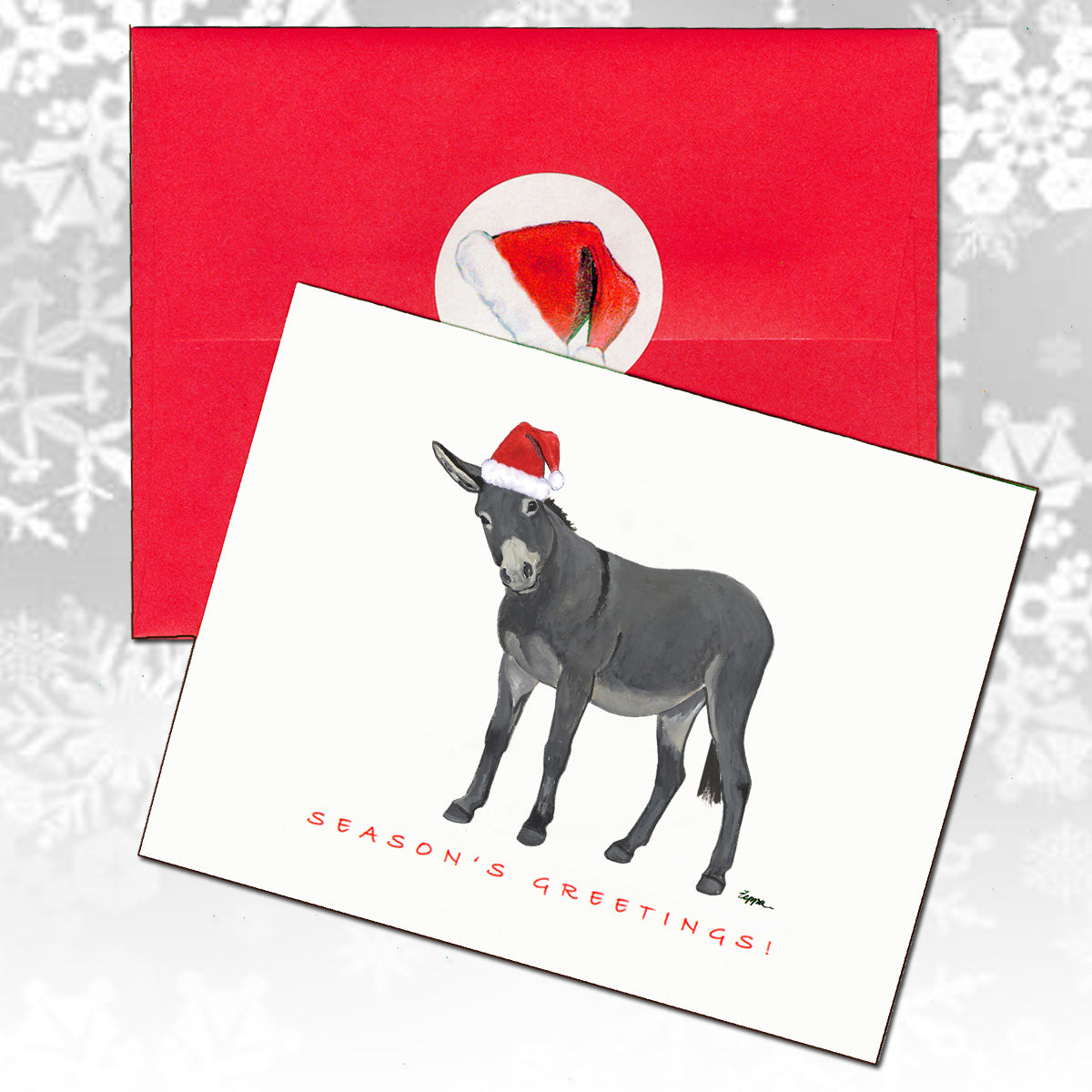 A holiday greeting card featuring a watercolor illustration of a donkey wearing a Santa hat, shown with a red envelope.