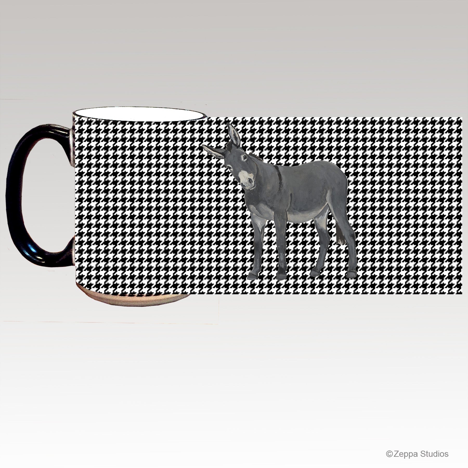 A ceramic mug with a black and white houndstooth pattern and a gray donkey illustration.