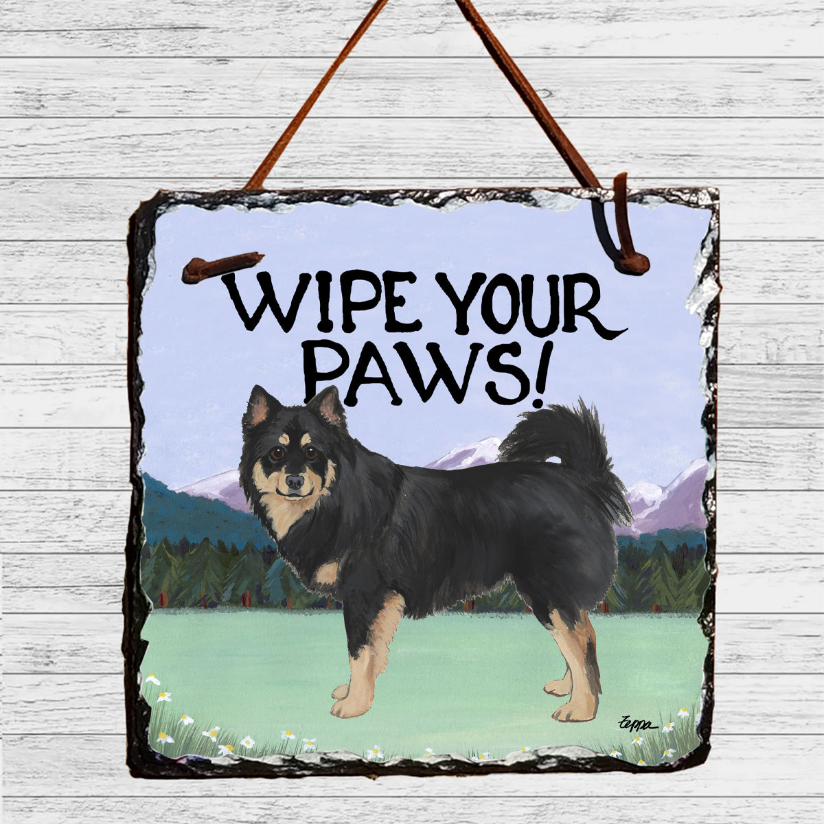 Finnish Lapphund on a wipe your paws slate sign.