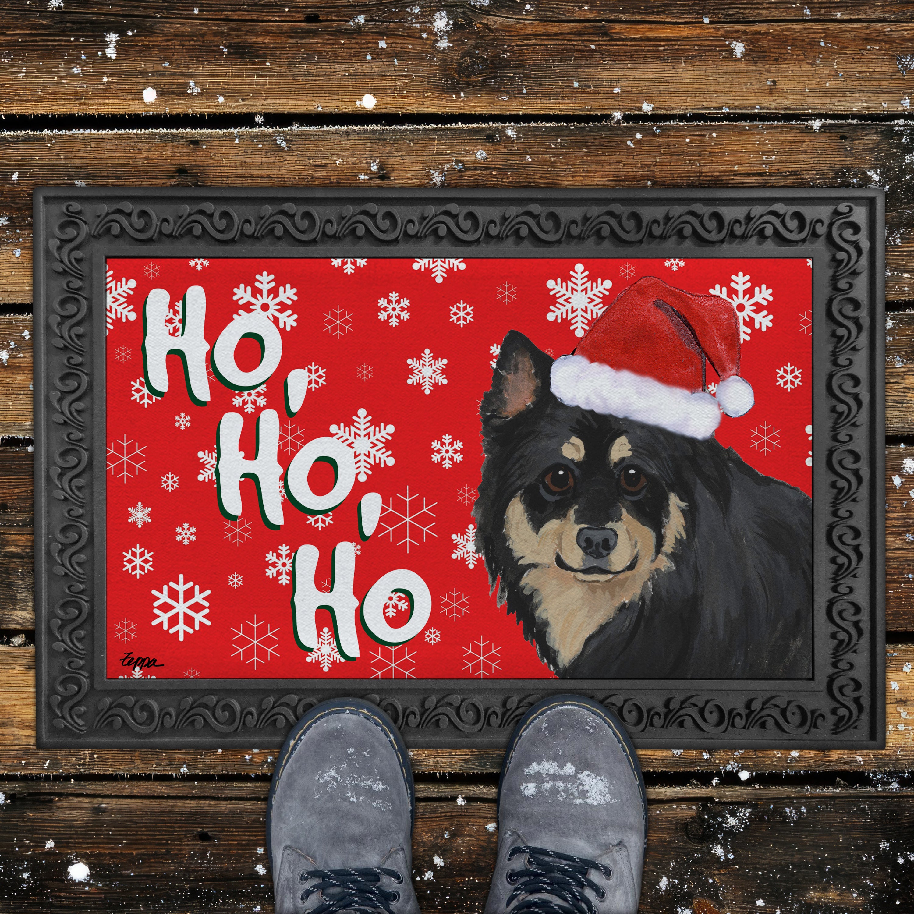 Doormat with a Finnish Lapphund wearing a Santa hat and 'Ho Ho Ho' text on a red background.