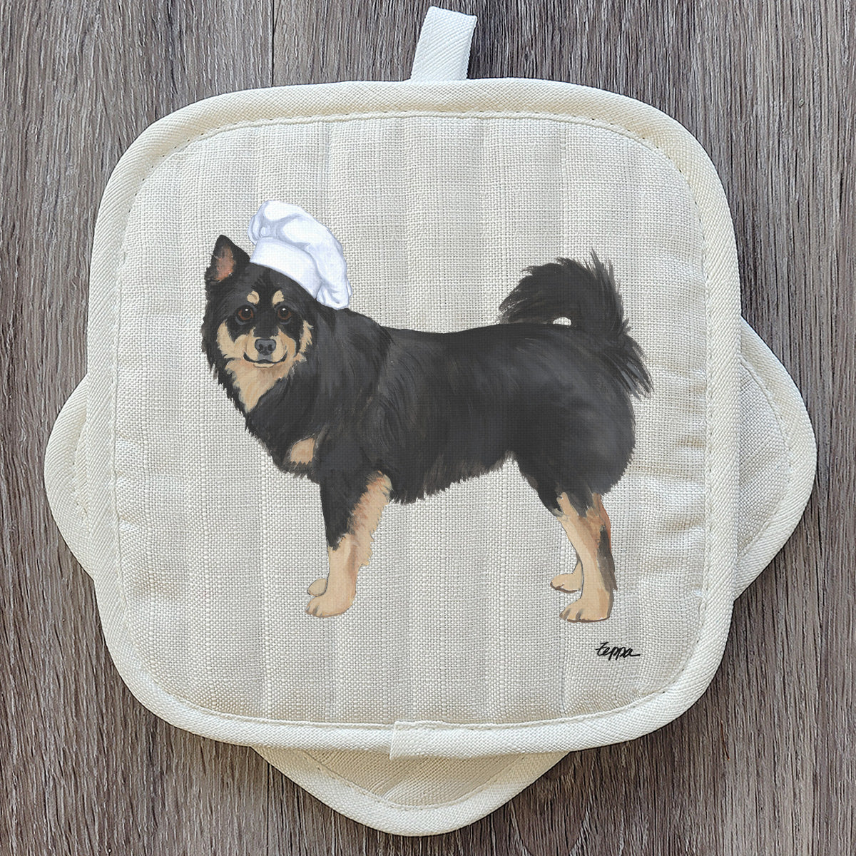 Finnish Lapphund in a chef's hat pot holder set.