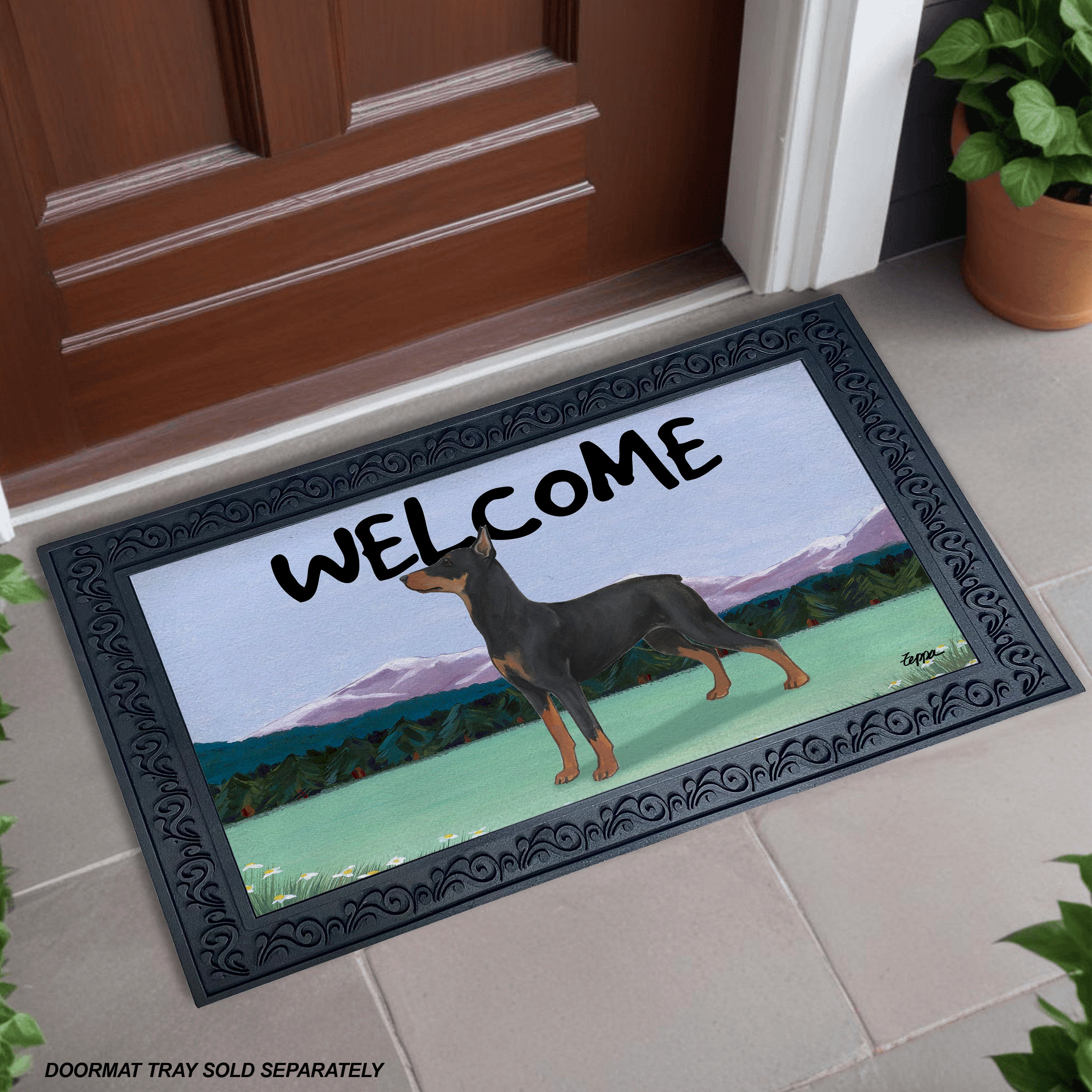 A doormat with a decorative black tray and a printed scene of a German Pinscher in a landscape, with the word 'WELCOME' in large black letters across the top. 