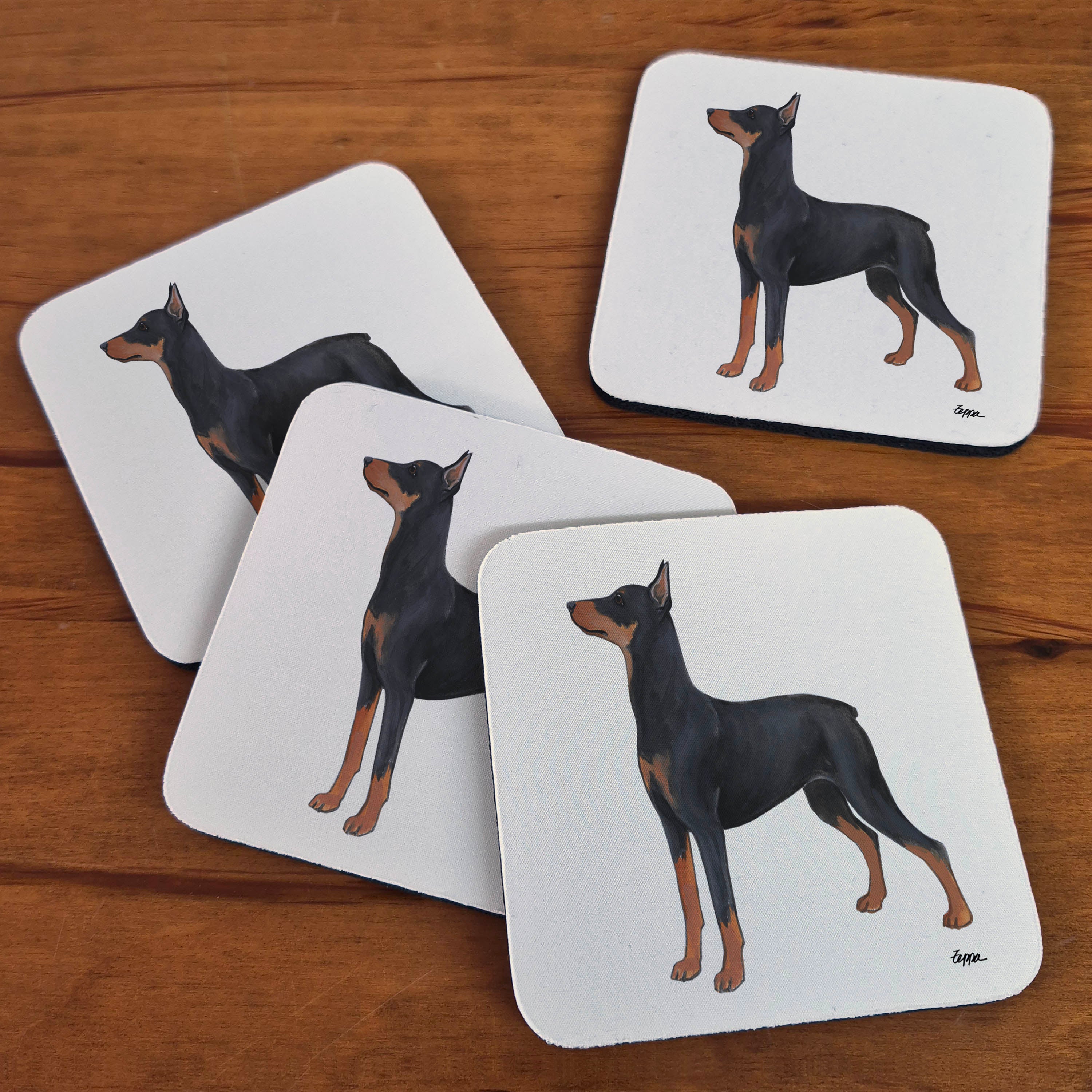 Set of 4 beige rubber coasters with an illustration of a German Pinscher.