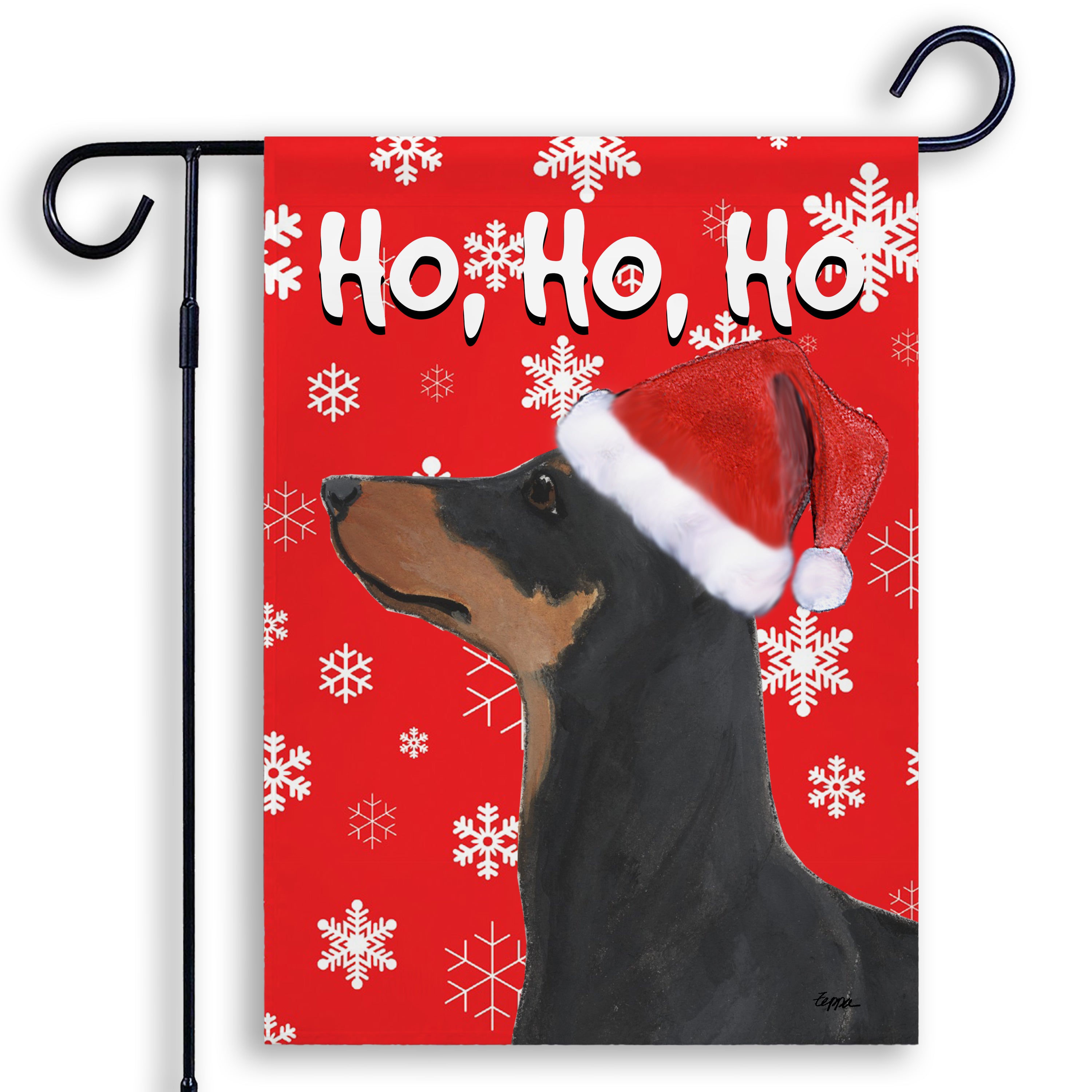 German Pinscher in a Santa hat on a Garden Flag with a red background with Ho Ho Ho text and white snowflakes.