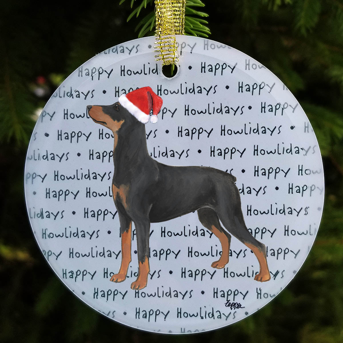 A frosted white glass ornament  featuring a German Pinscher  wearing a red Santa hat on a repeating green 'Happy Howlidays' text pattern.