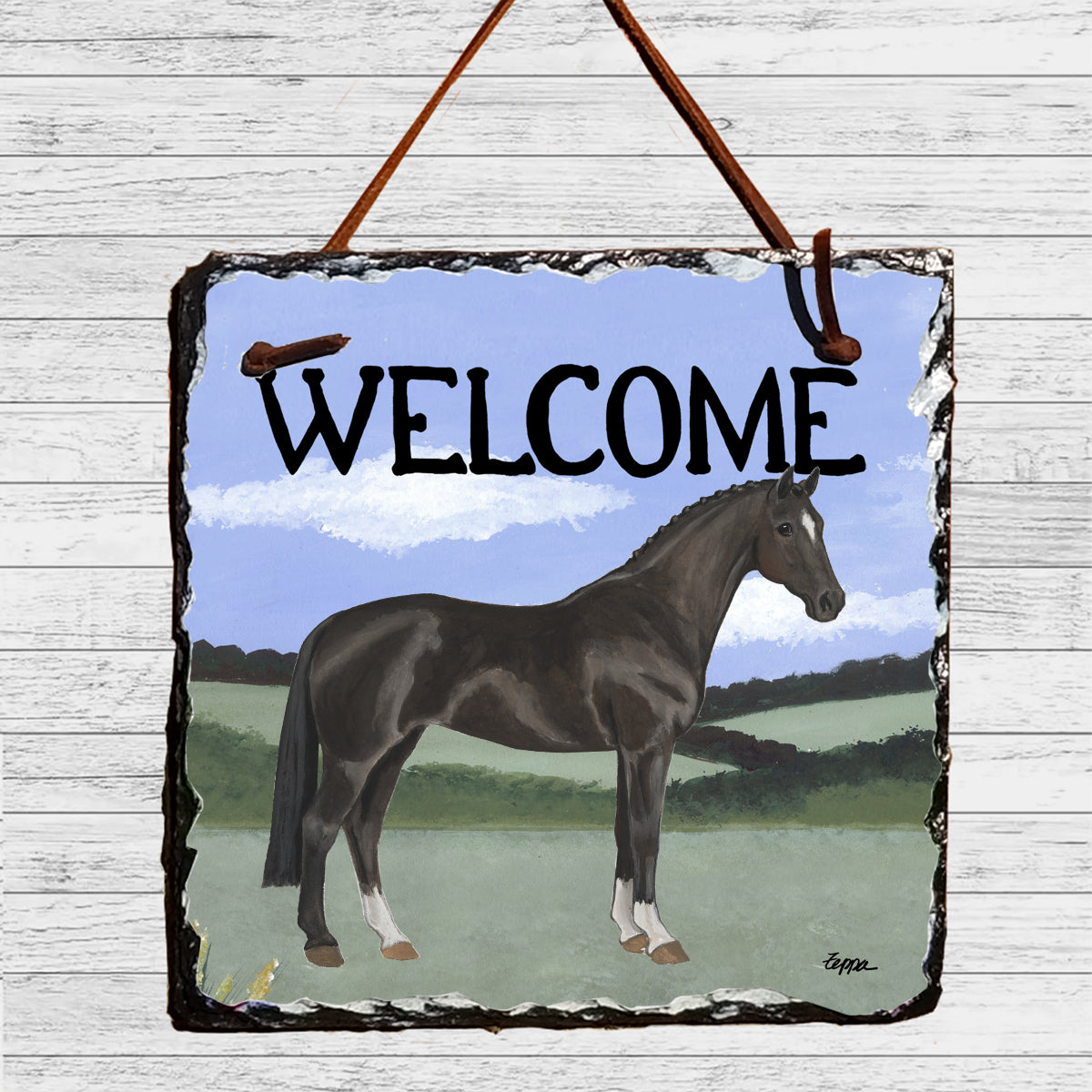 Hanoverian horse in a field on a square slate hanging welcome sign.